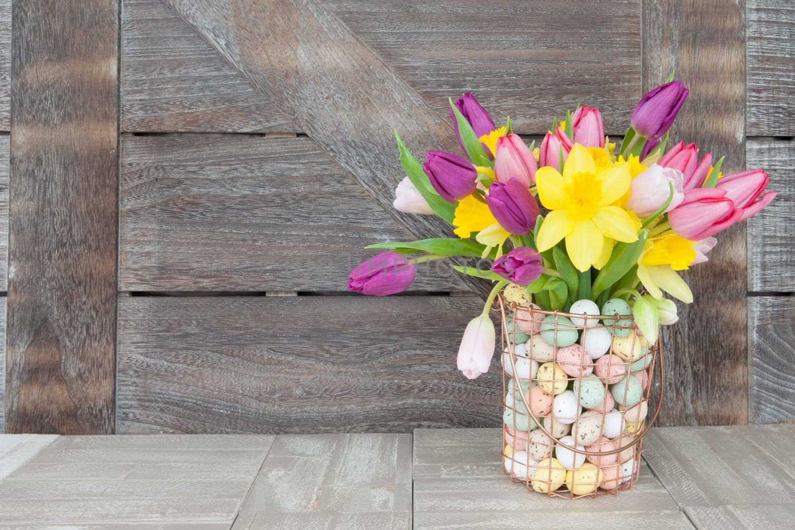 Easter bouquet with fresh tulips and daffodils
