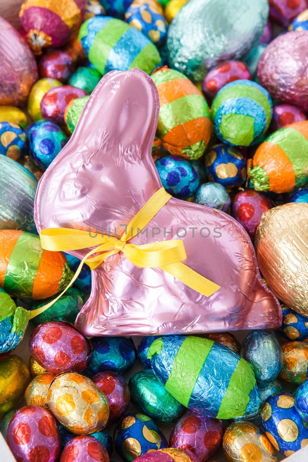 Lots of colorful Easter eggs and chocolate bunnies