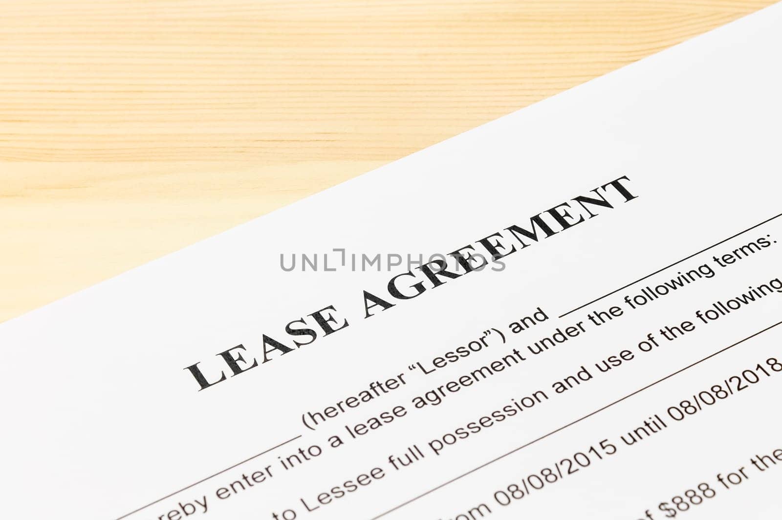 Lease Agreement Contract Document on Wood Table. Legal document for business event