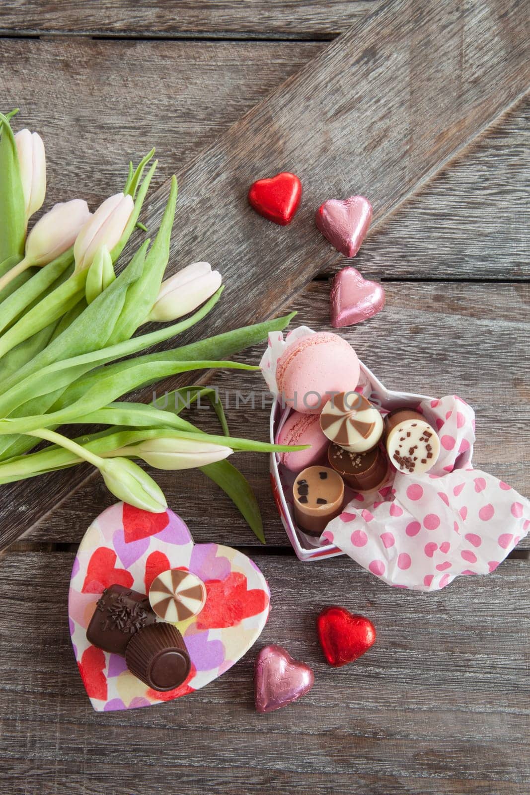 Heart box with chocolate and fresh flowers