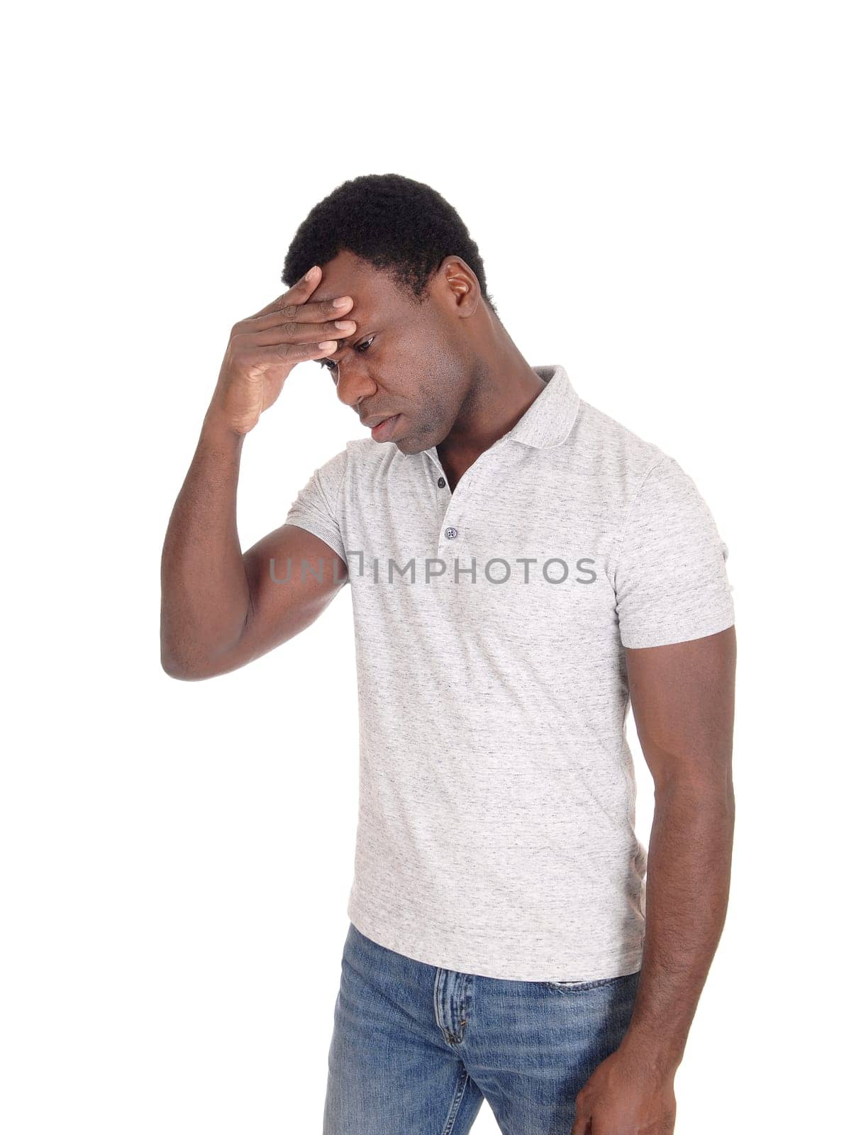A African American man standing isolated for white background with.one hand on his forehead, looking sad, isolated for white background.