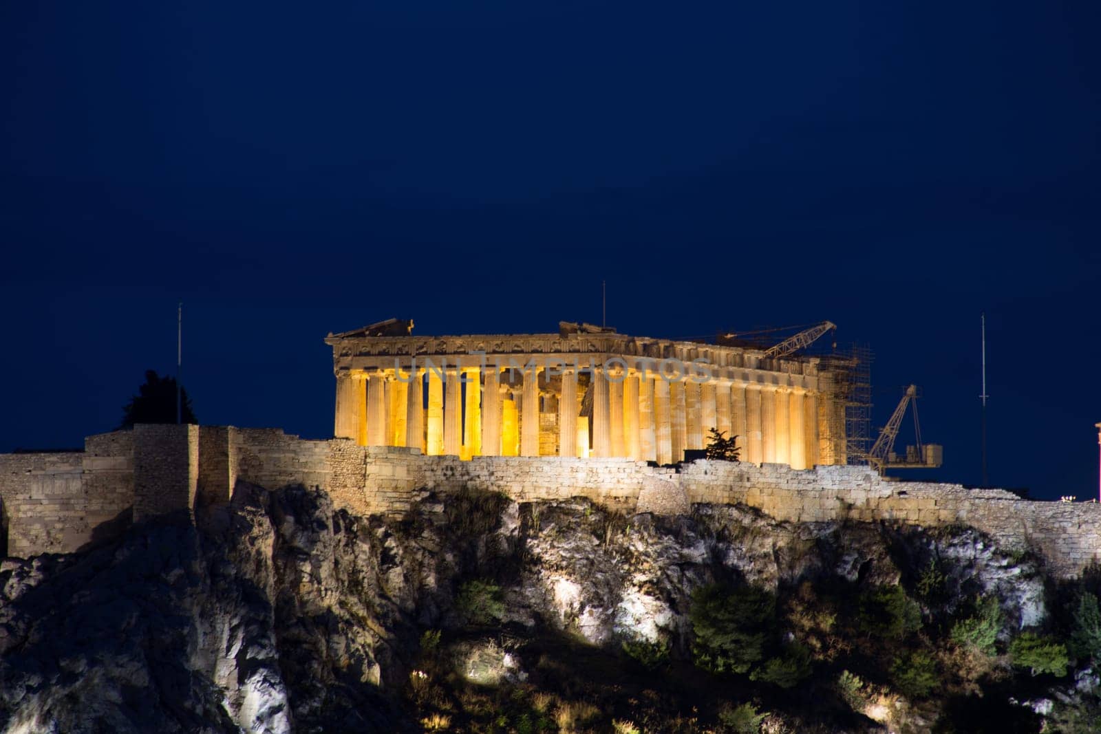 The Acropolis and Parthenon at night in Athens, Greece