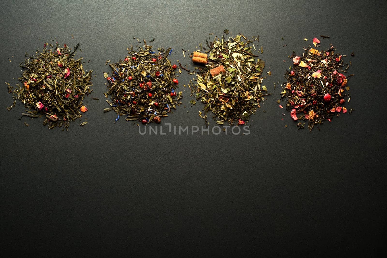 Dry tea collection of different types on black background