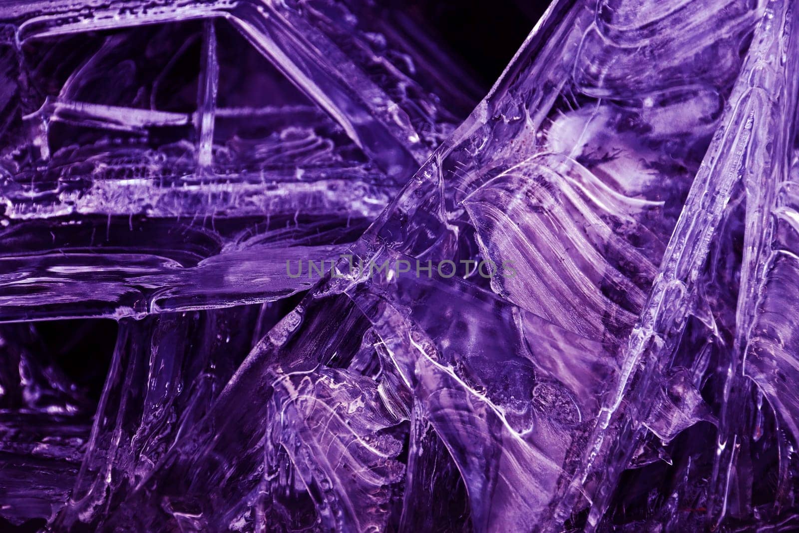 Close-up of frozen water in ultra violet. Abstract ice on a lake