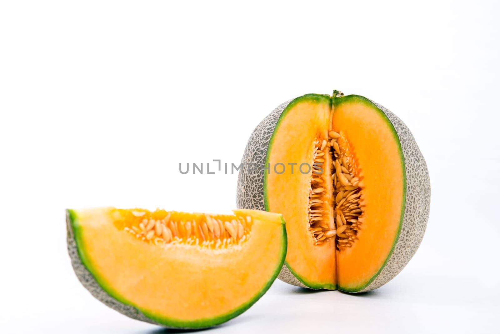 fresh sweet cantaloupe melon on white ground