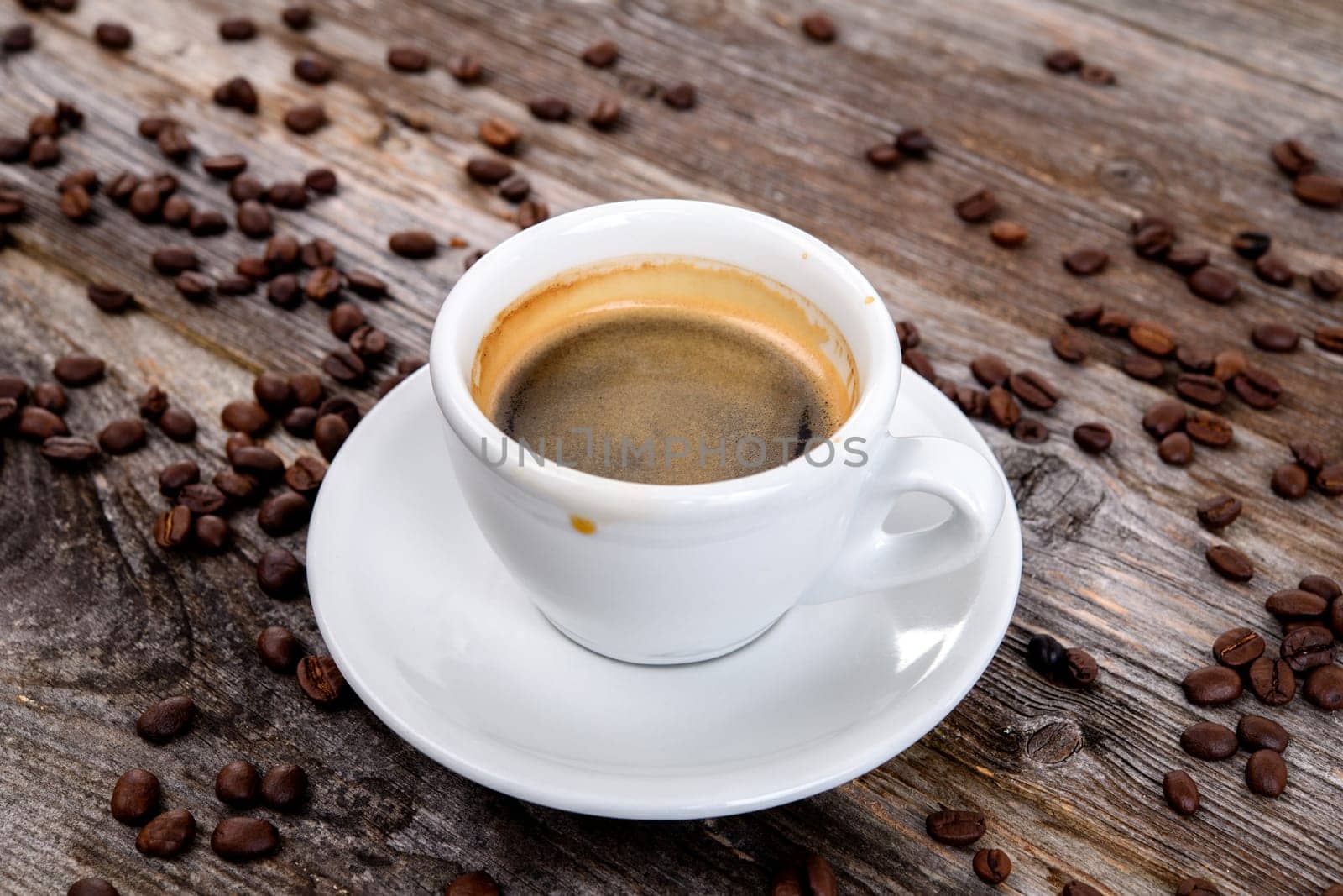 espresso cup with a lot of coffee beans