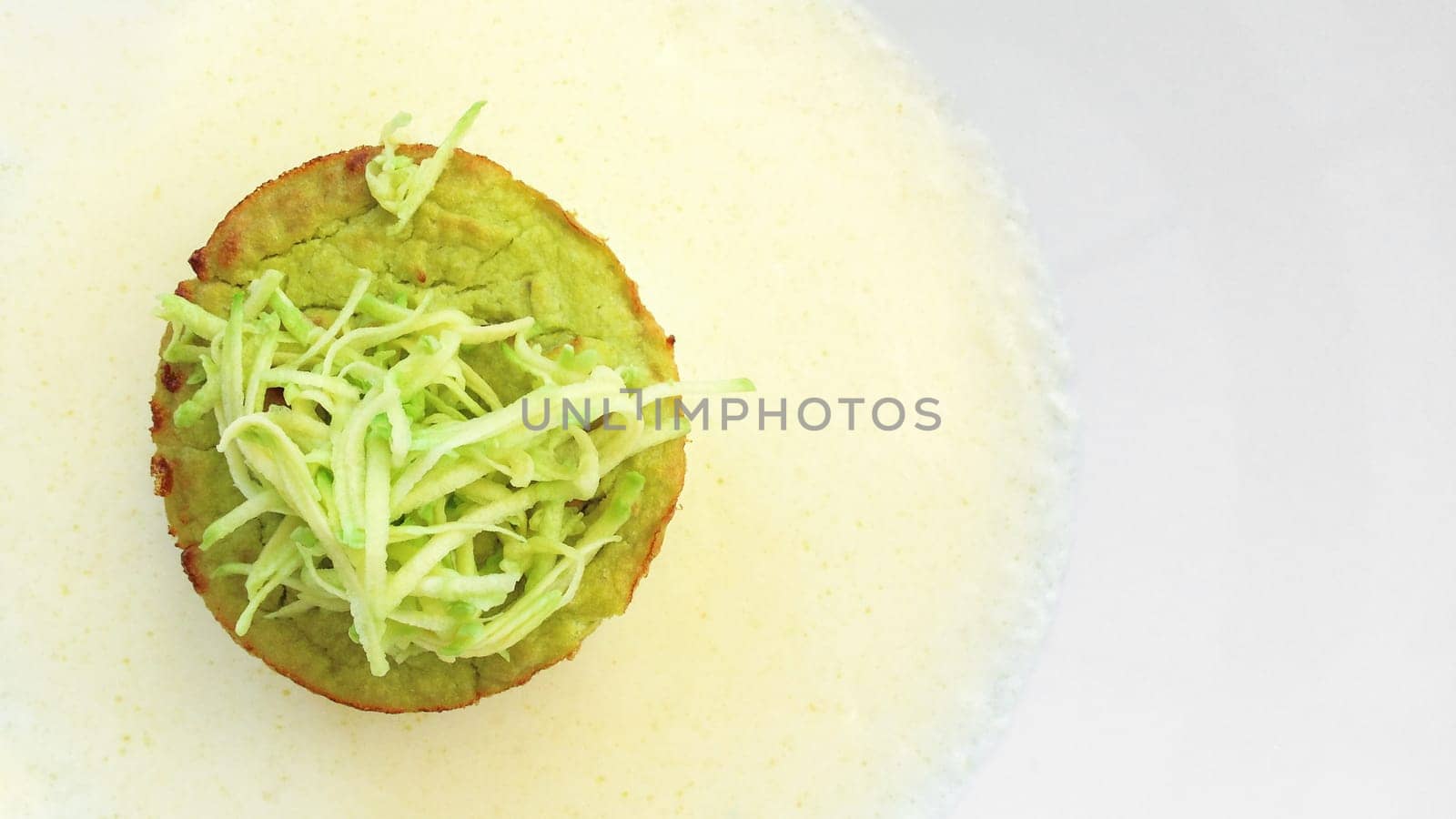 Flan zucchini cake on white plate. Flat lay.