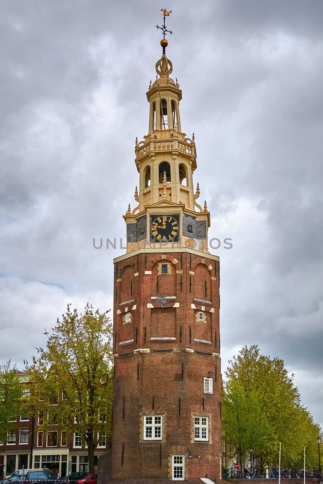 Tower (Montelbaanstoren) on Bank of the Canal Oudeschans in Amsterdam, Netherlands