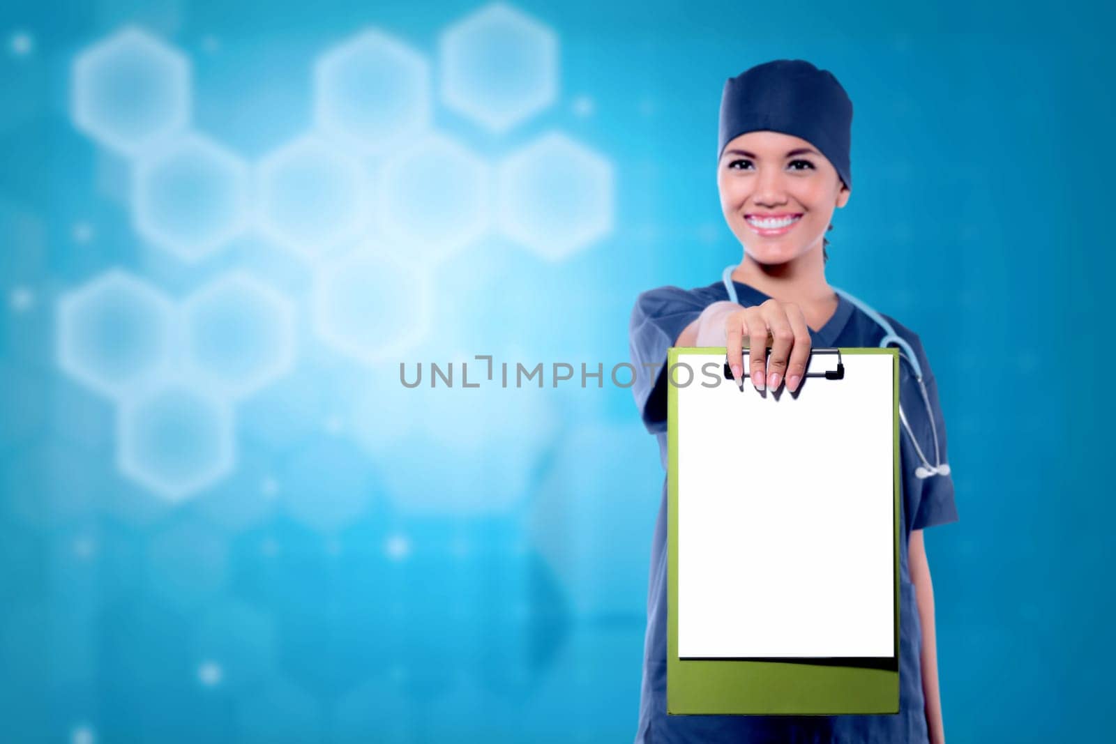 Pretty asian woman doctor showing blank clipboard for copyspace on abstract background