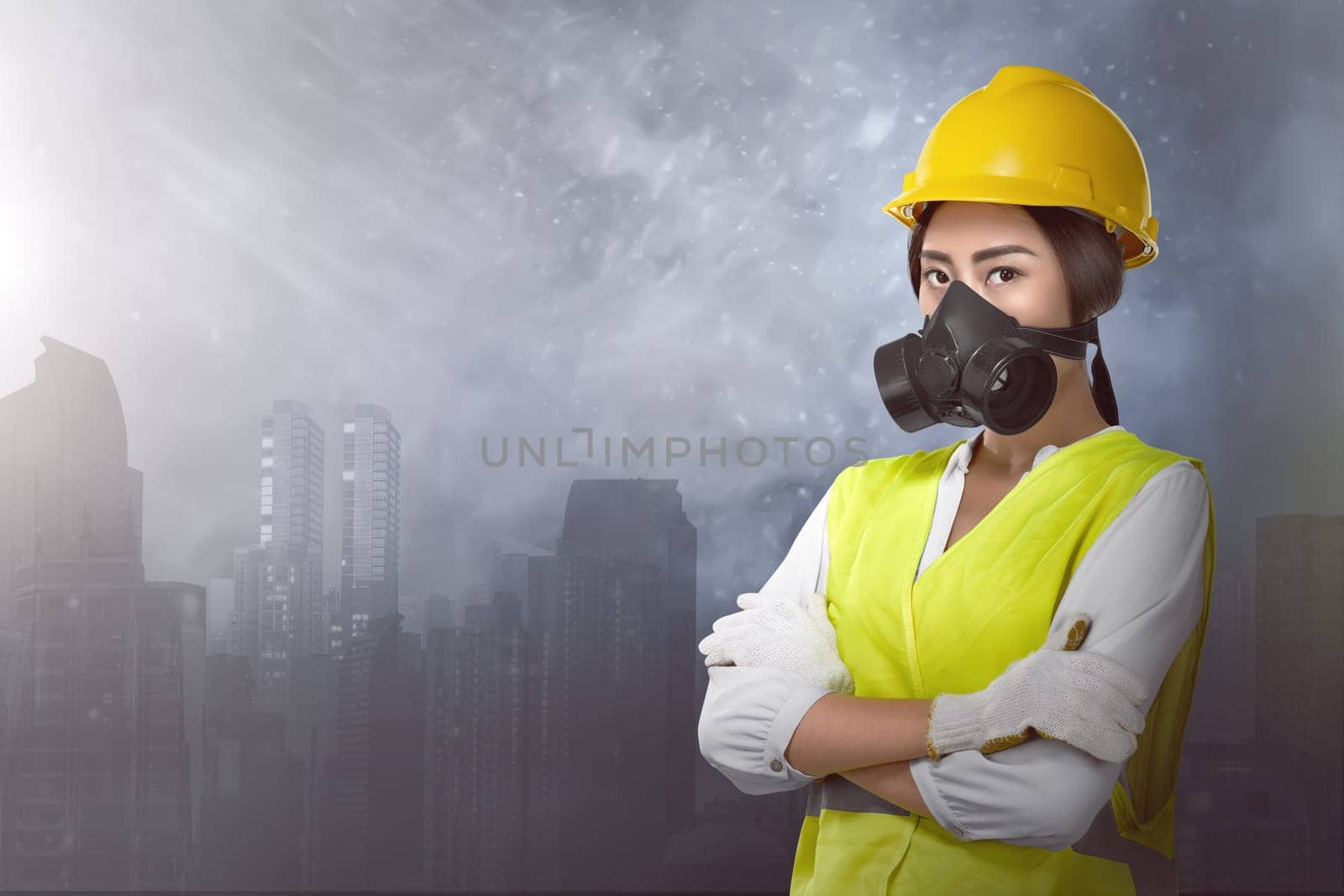 Beautiful asian woman engineer with protective mask against city background