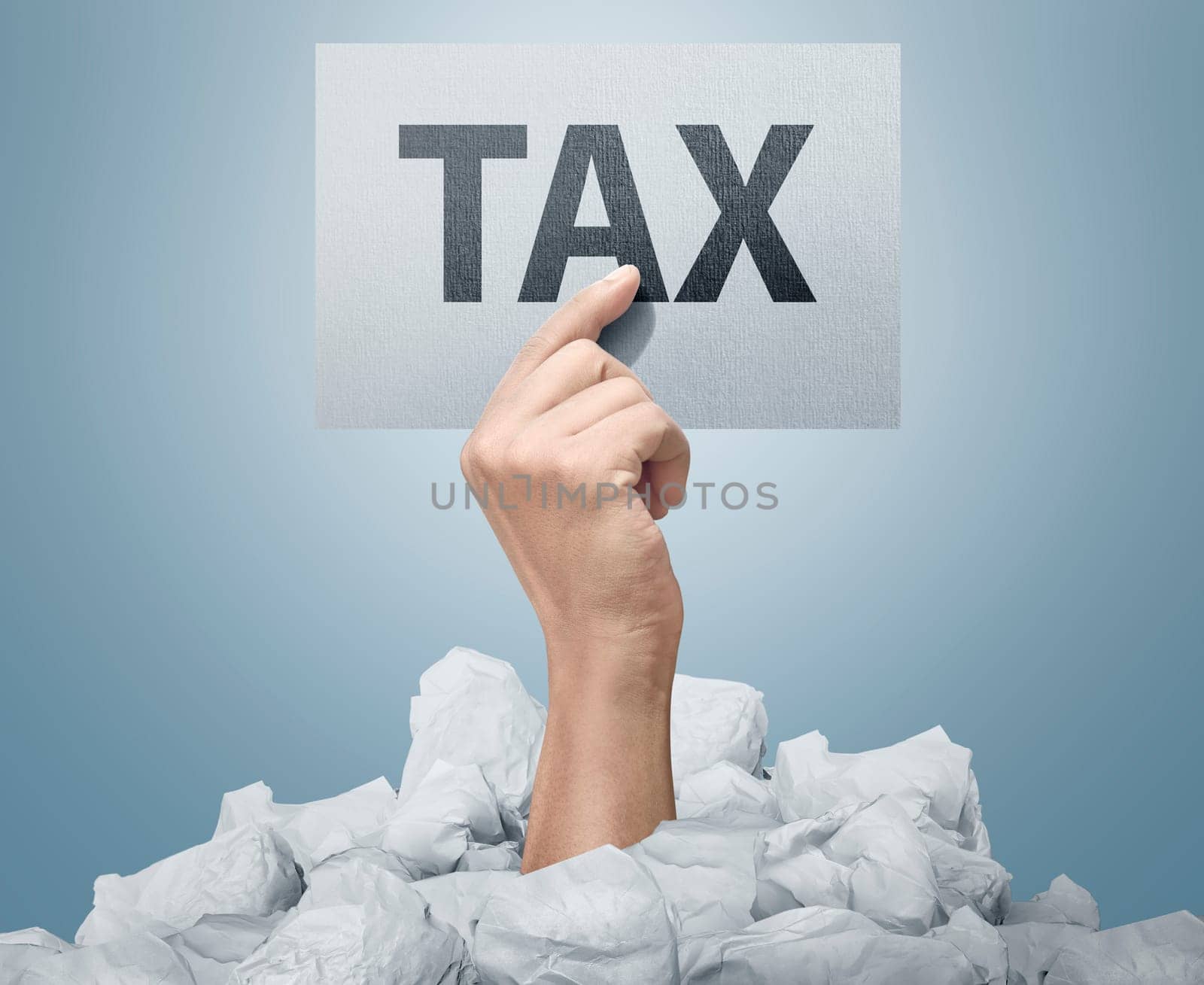 People hand holding paper with Tax sign over bright background