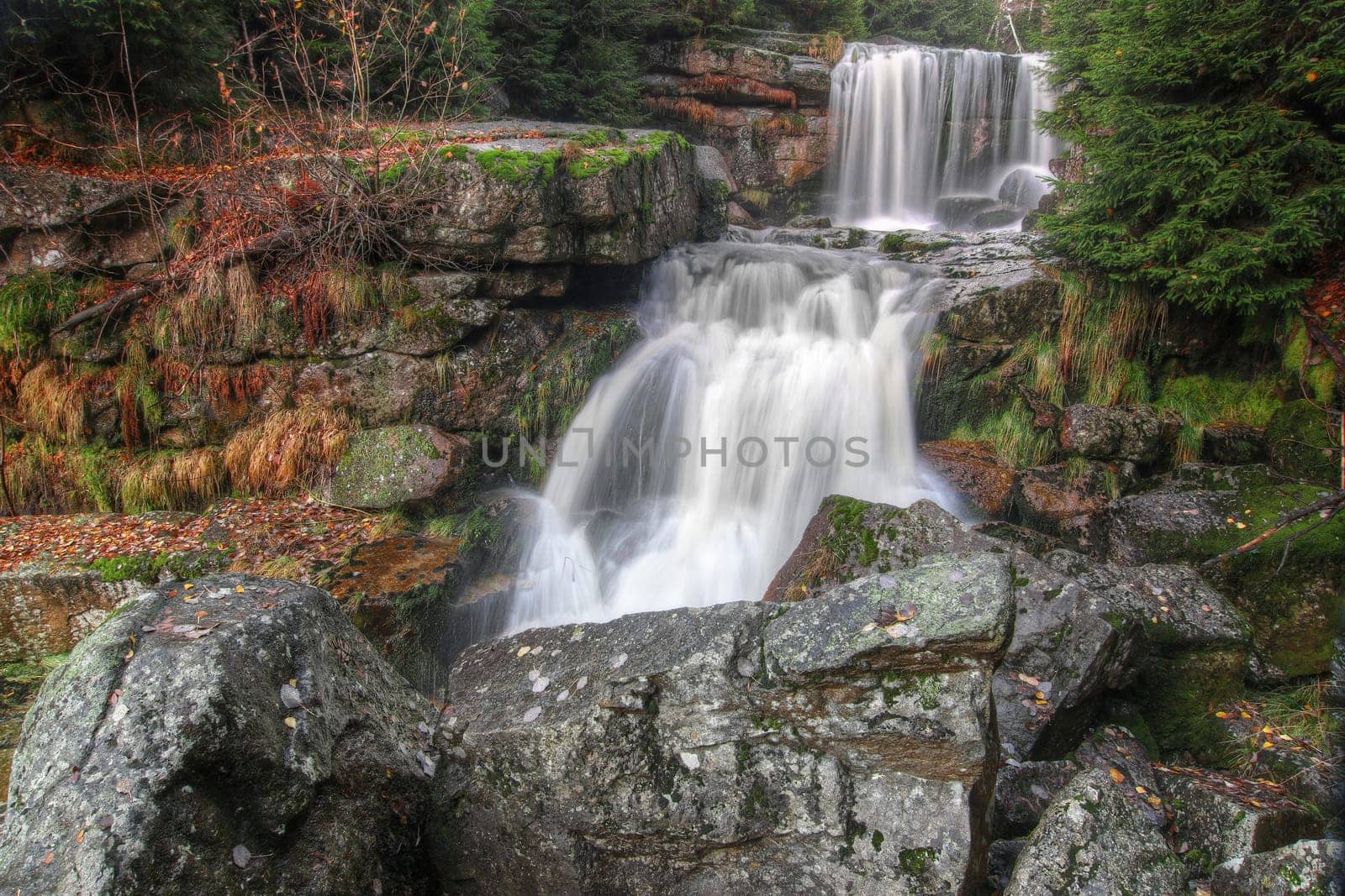 Waterfalls in the autumn forest - Jedlova waterfall in the Jizera Mountains, Czech republic