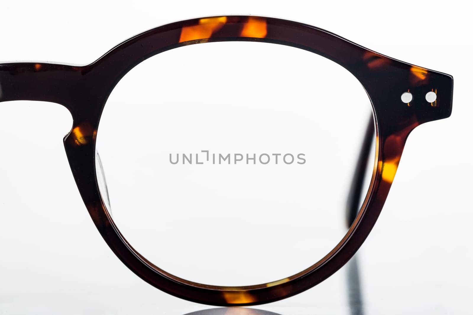 Fashionable men's glasses on a bright background