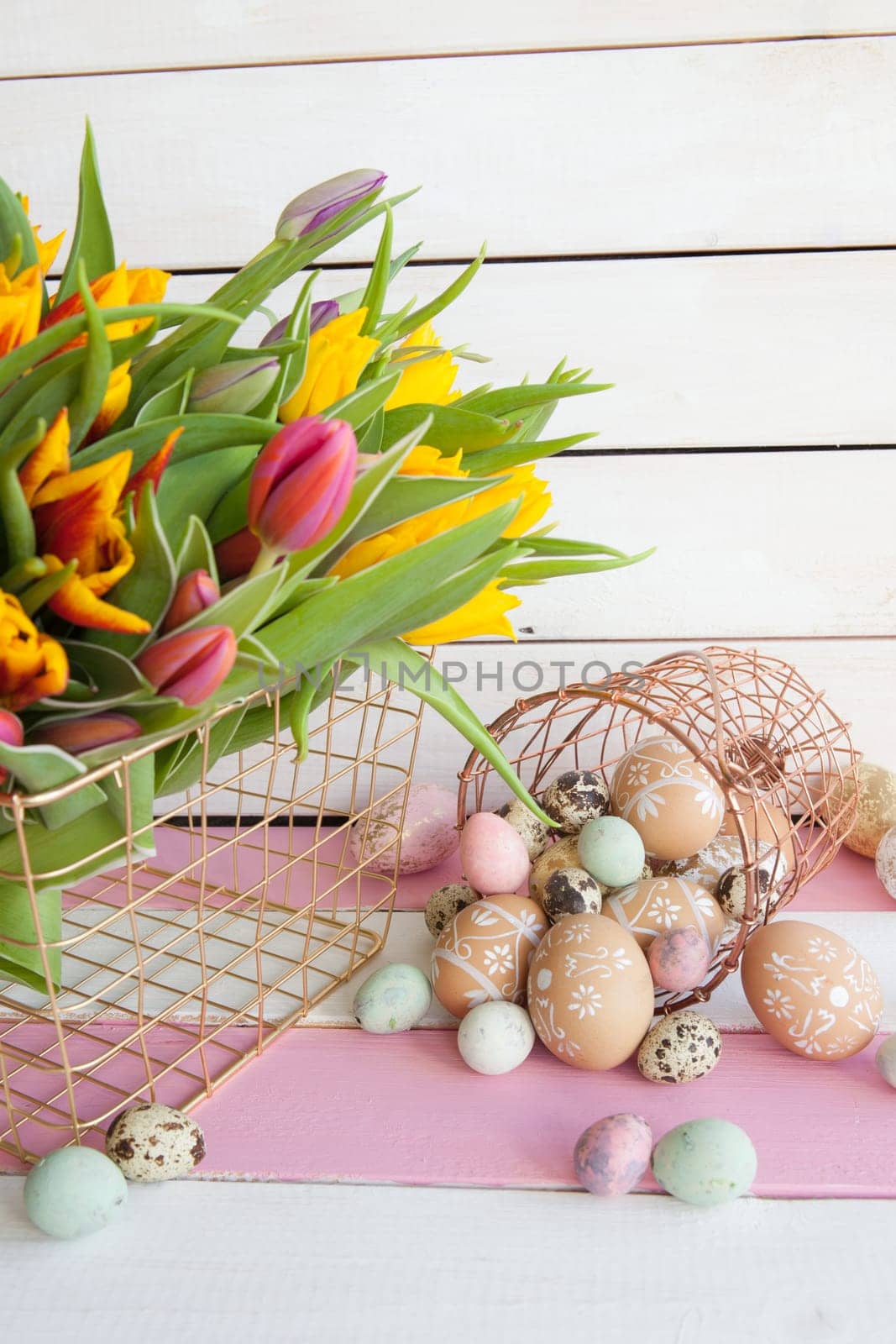 Painted eggs and fresh tulips for Easter
