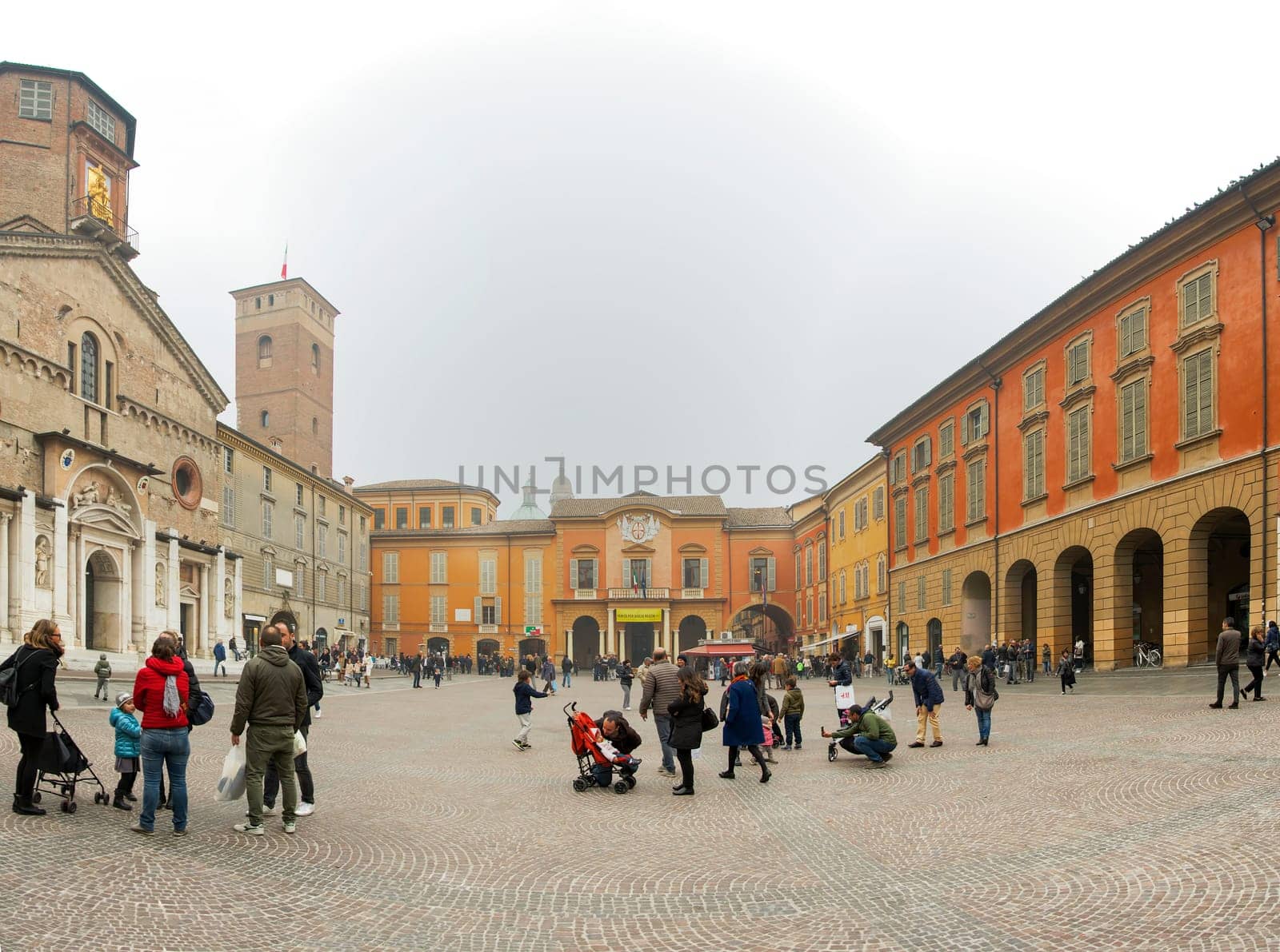 Reggio Emilia, Italy, november 2017: panoramic view of the Piazza del Duomo (now Piazza Prampolini) in the city center of Reggio Emilia in Italy with people enjoying the outdoors