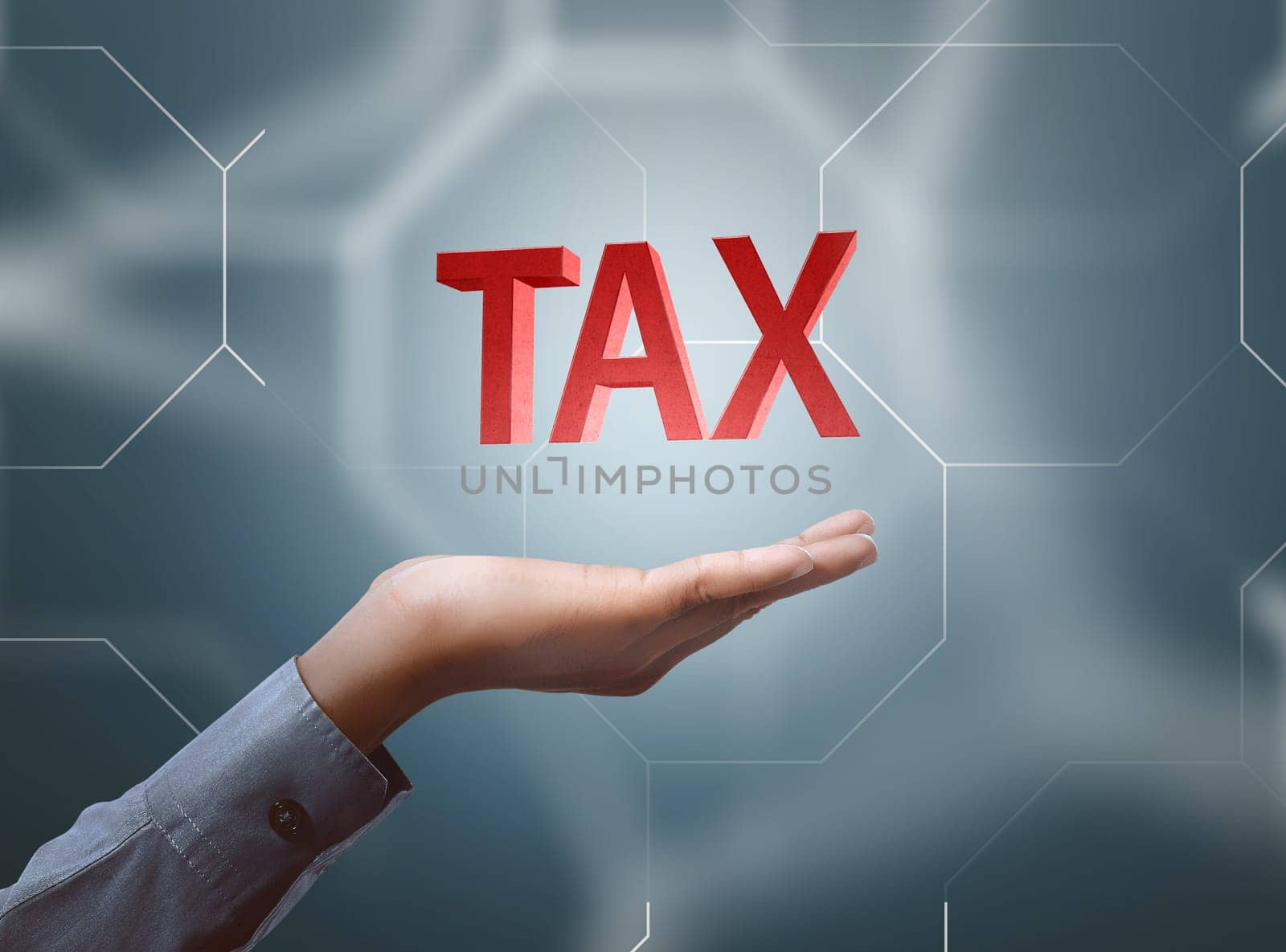 Businessman hand showing tax text. Taxation concept