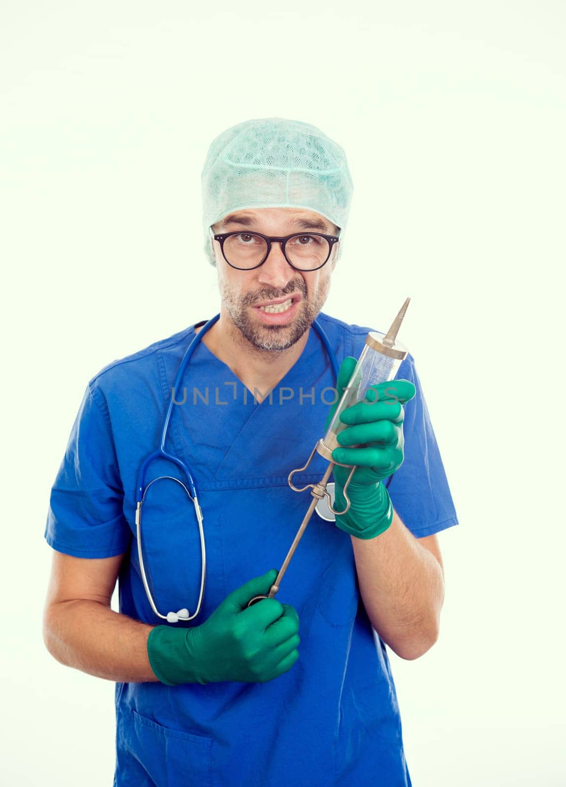 funny doctorwith big injection in front of white background