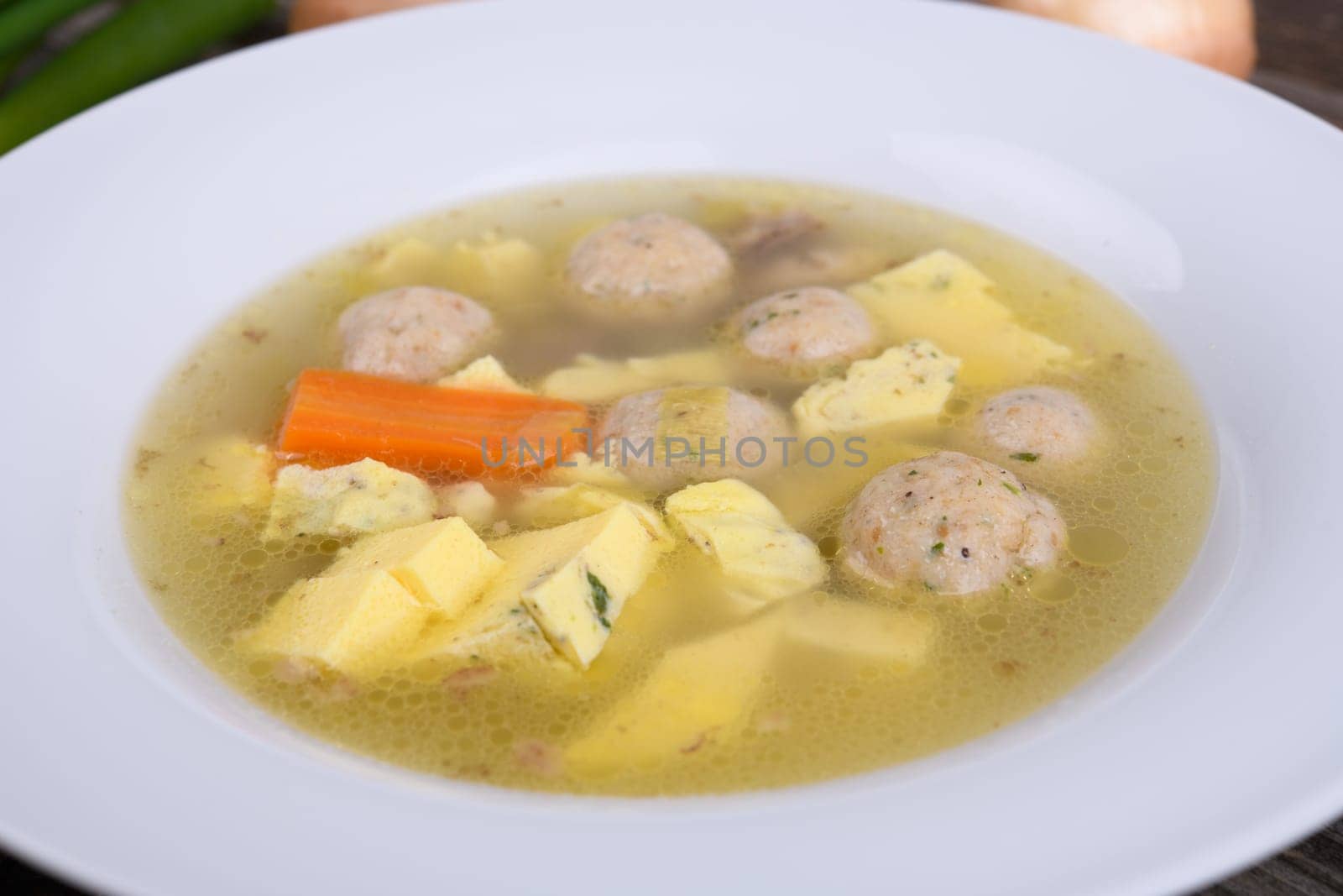 marrow balls soup in white plate - close up