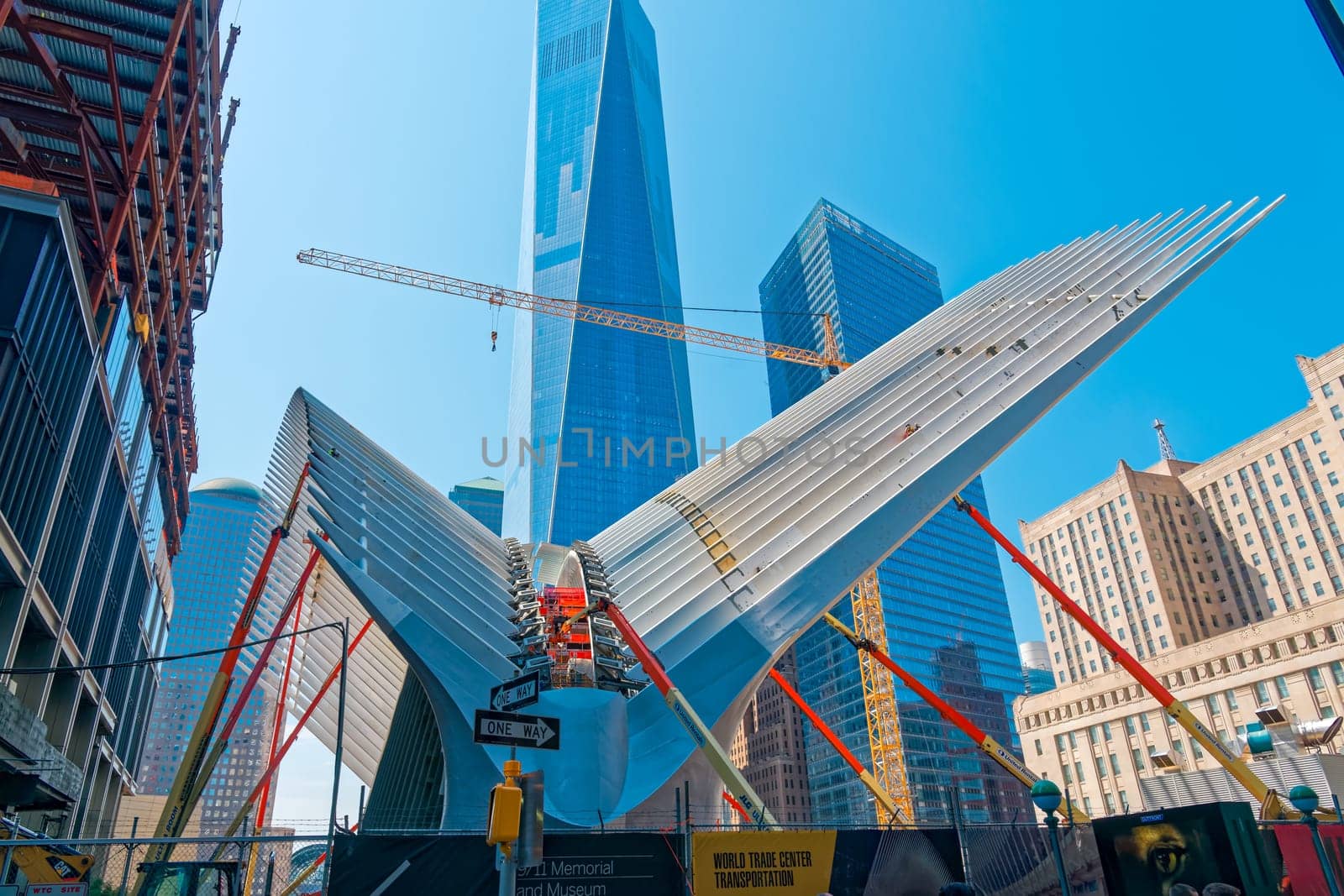 New York, USA - June 08, 2015: Ground Zero with the World Trade Center One and Transportation building late in the day in Lower Manhattan.