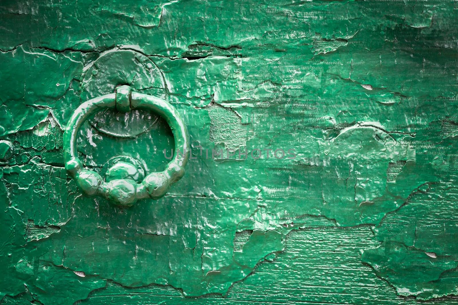 Green wood old knock door. Vintage style. Ideal for backgrounds and texture. Space for text.
