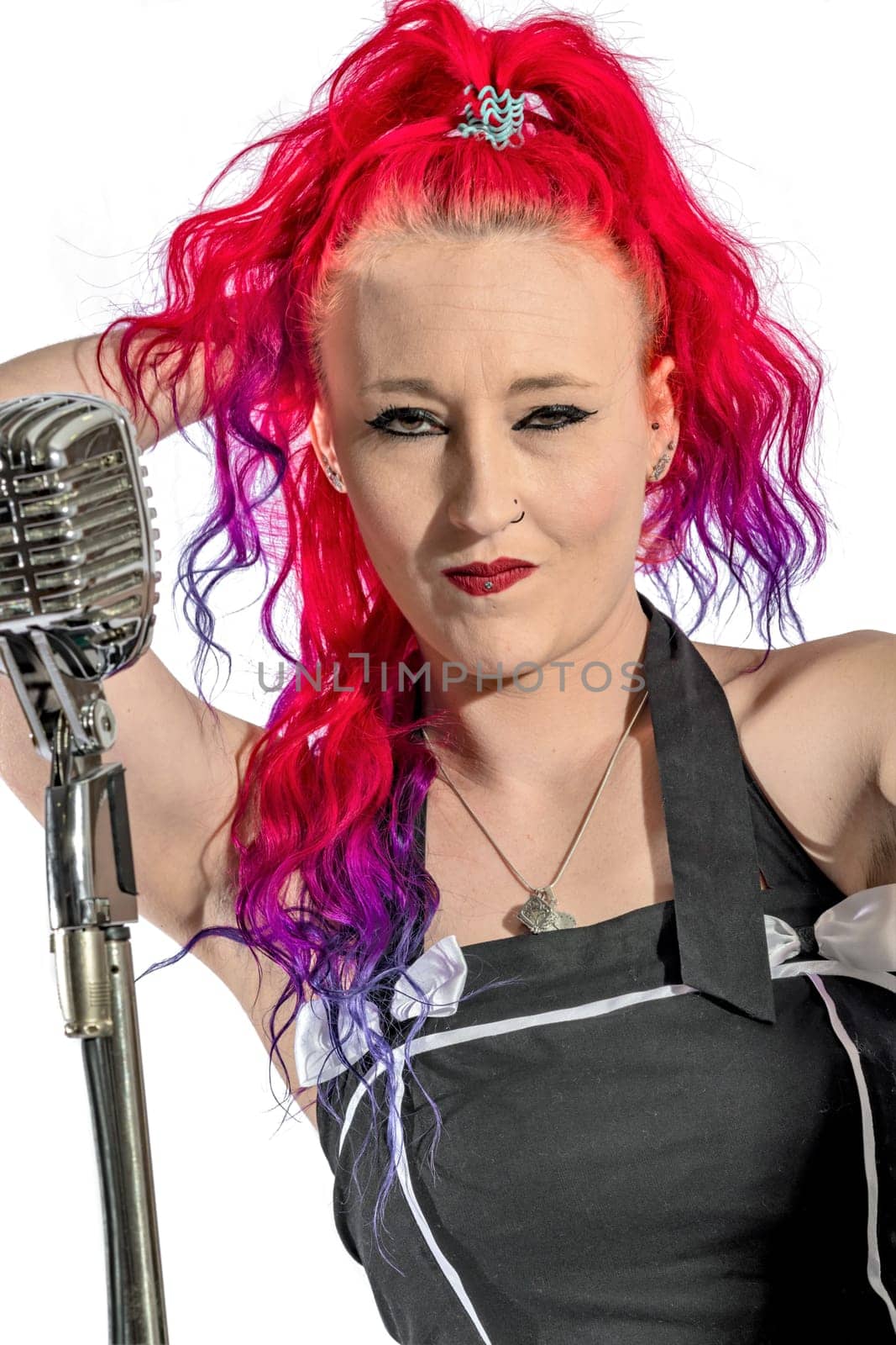 Rock'n'Roll singer with red hair and microphone