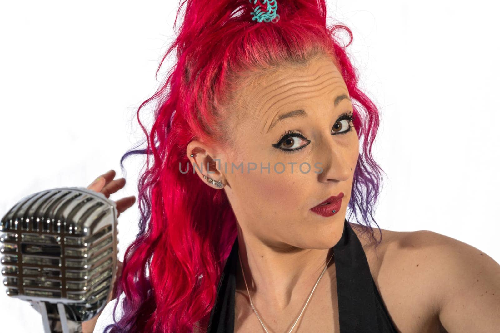 Rock'n'Roll singer with red hair and microphone