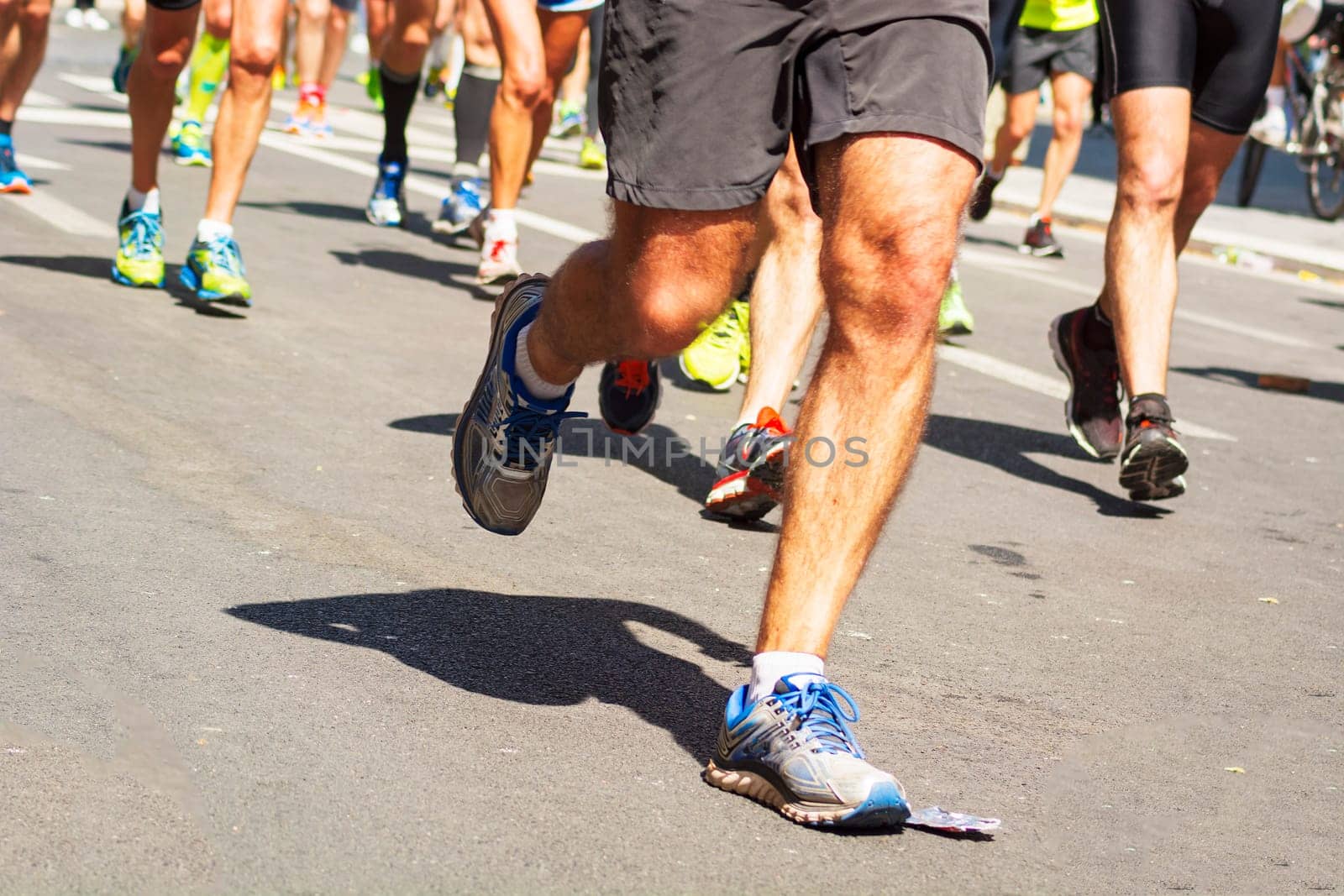 detail of running shoes of marathon runners