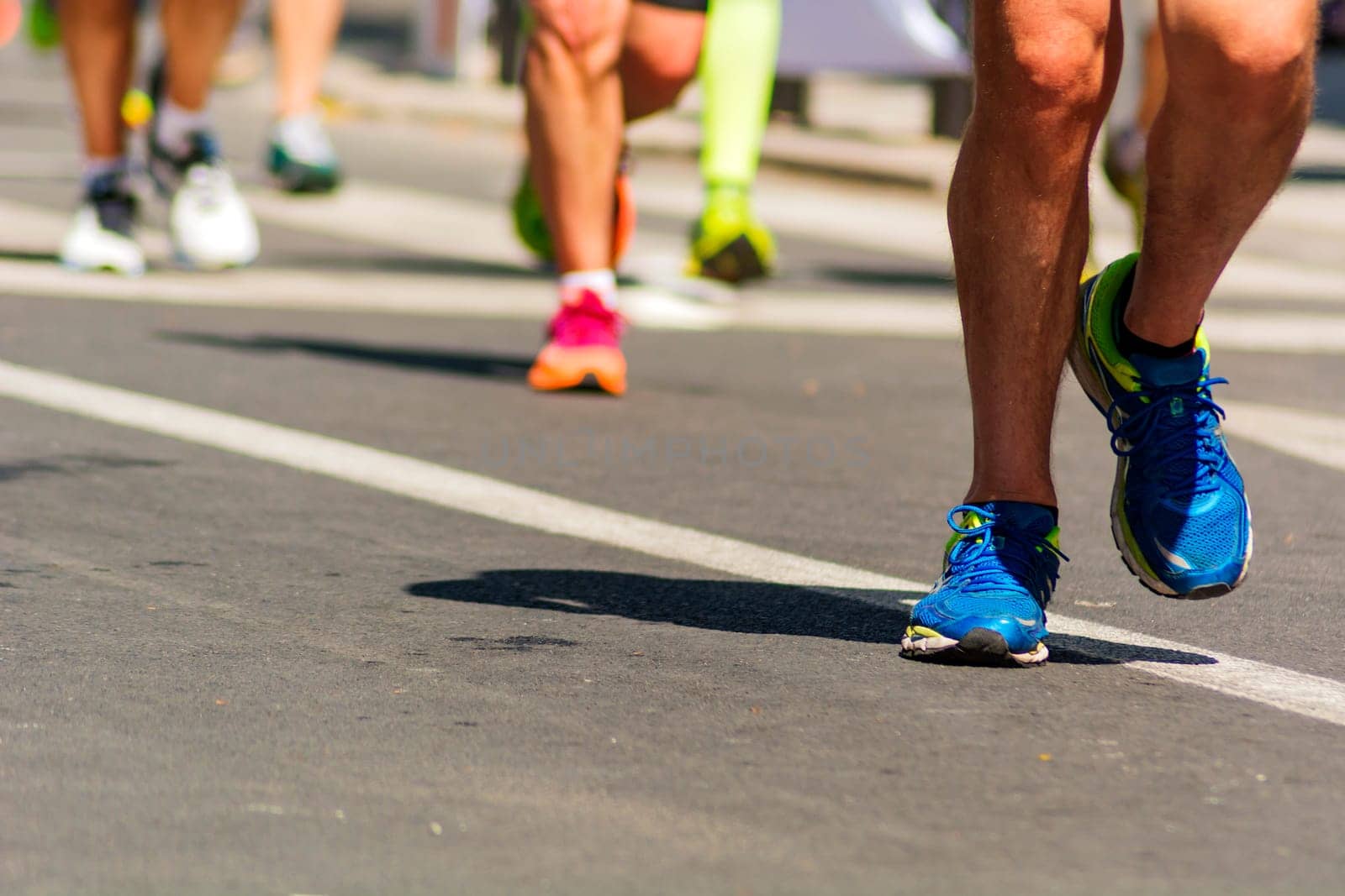 detail of running shoes of marathon runners