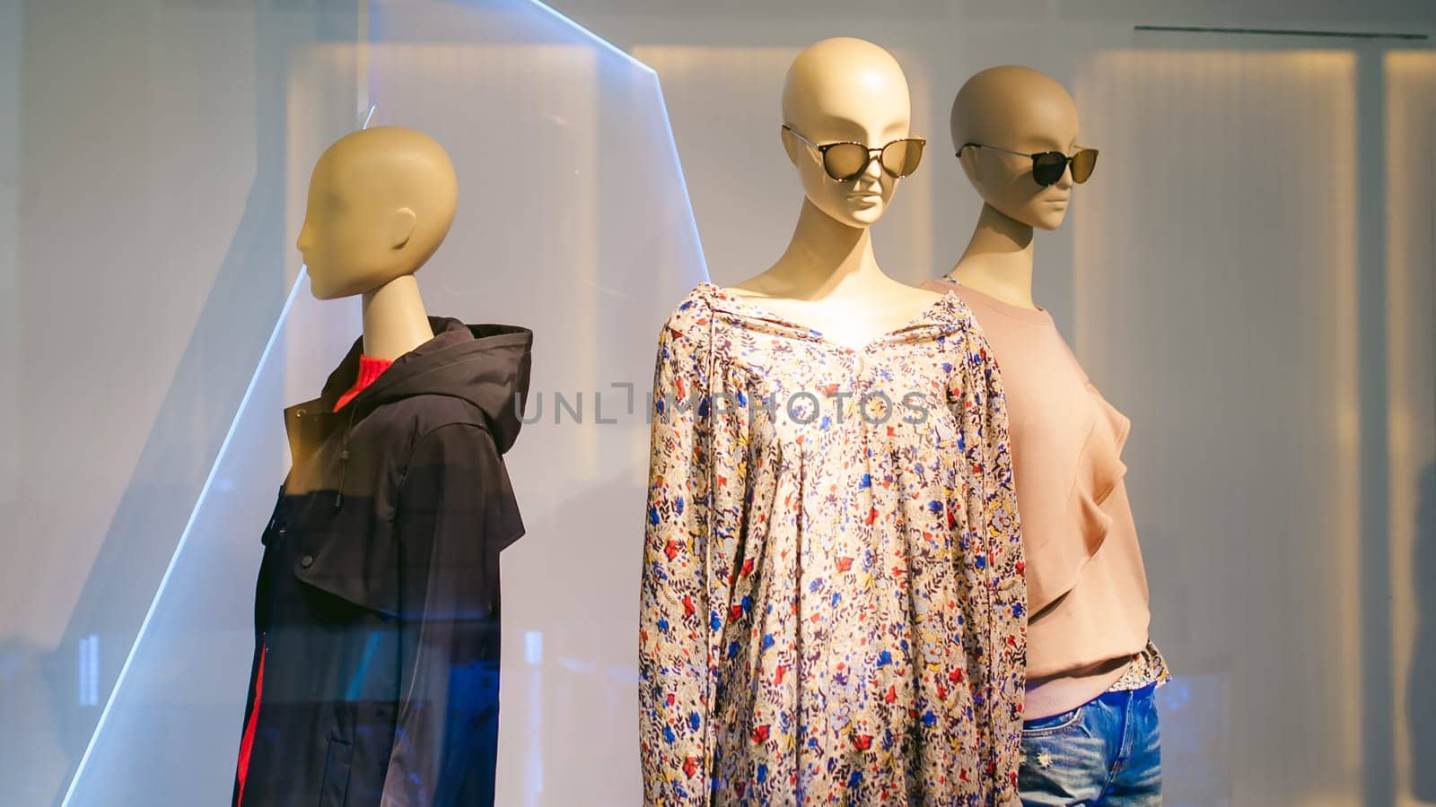 dummy on a shop window. Faceless woman with glasses