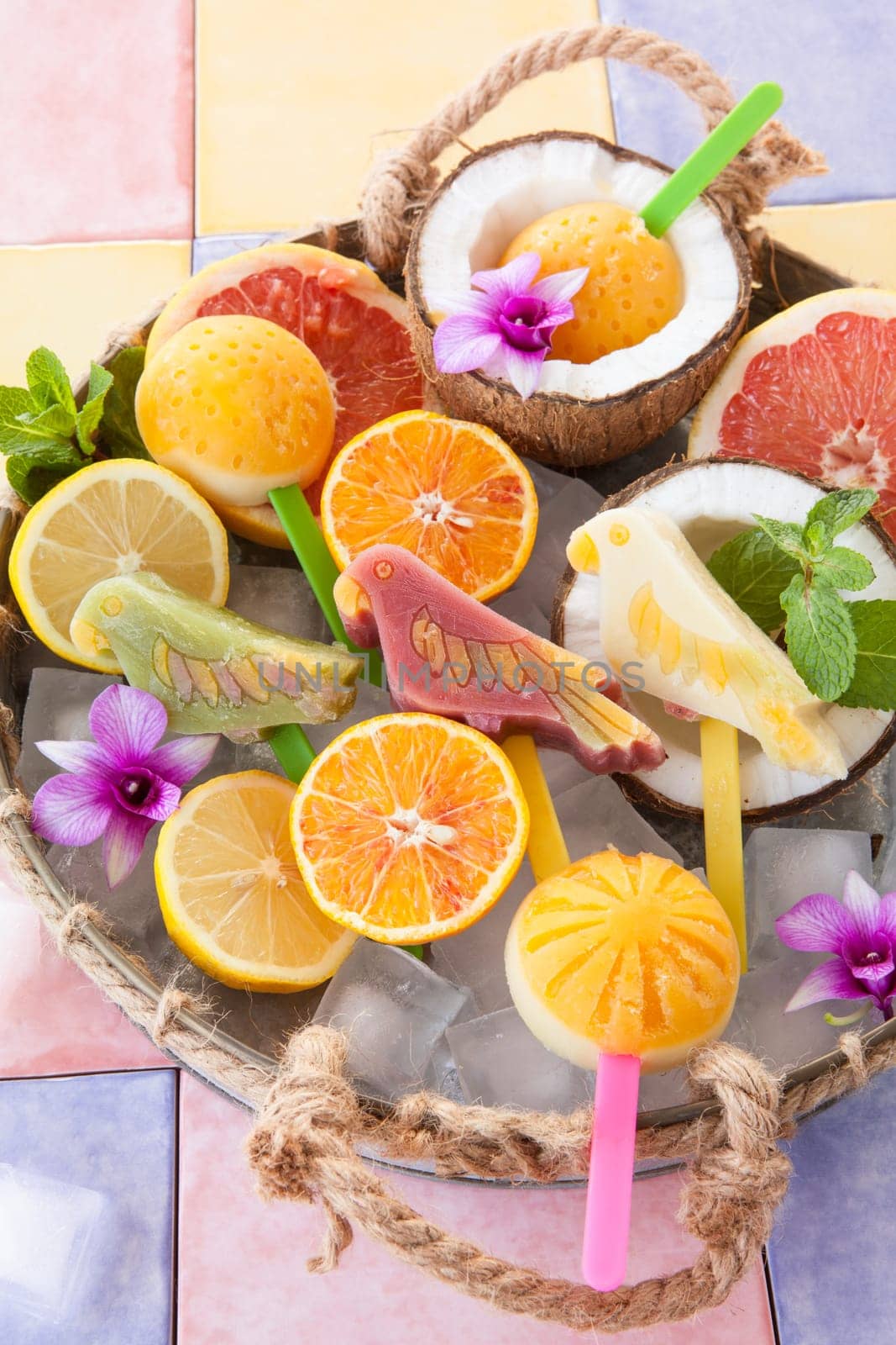 Colourful popsicles with fresh fruits