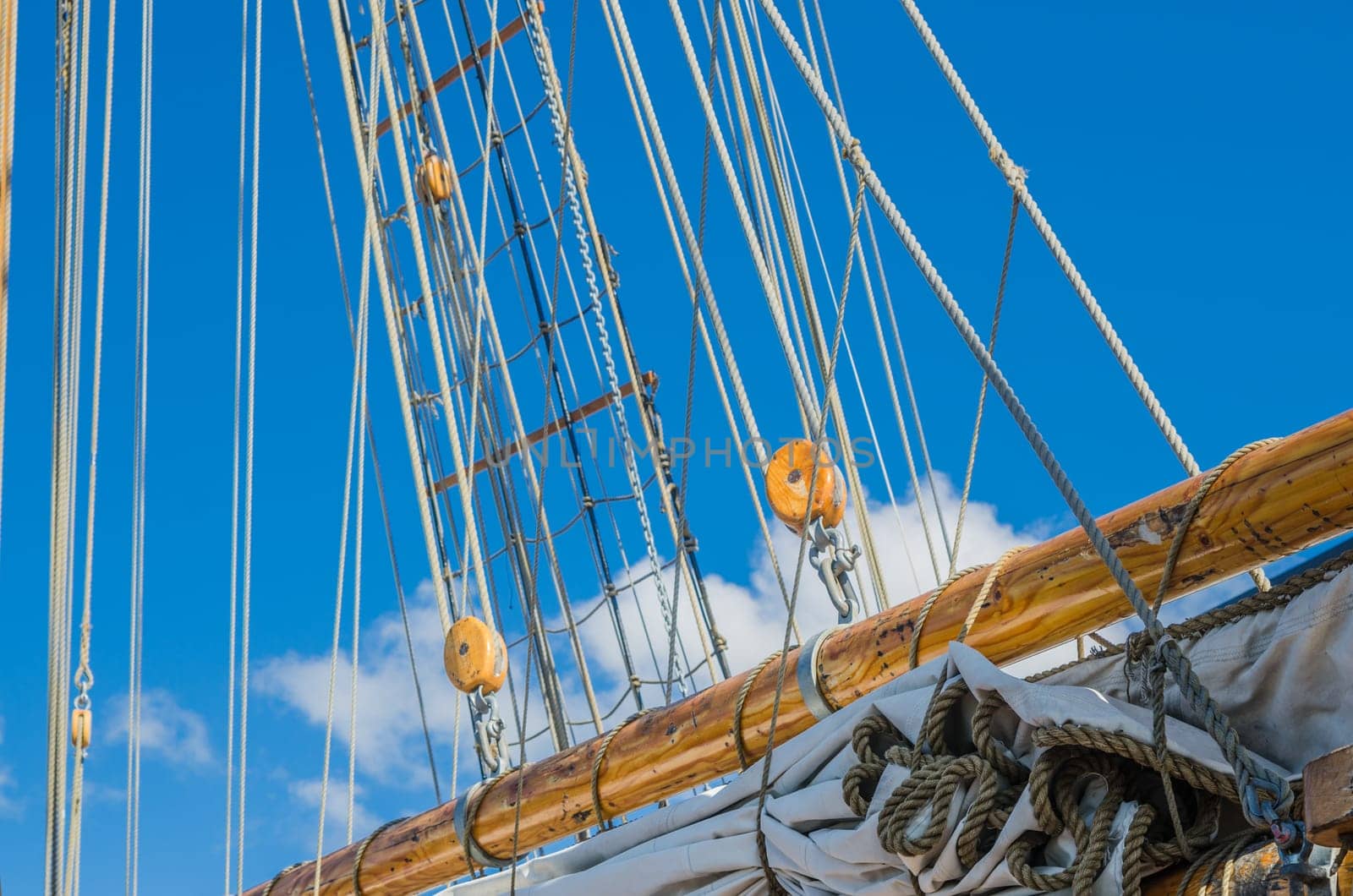 Folded sail and mast on an old sailboat