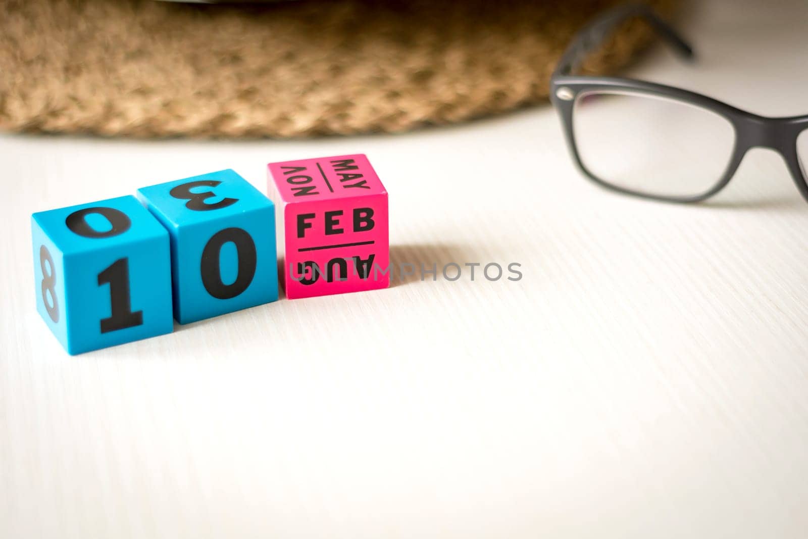 modern perpetual calendar composed of colored cubes and set at the date of February 10th