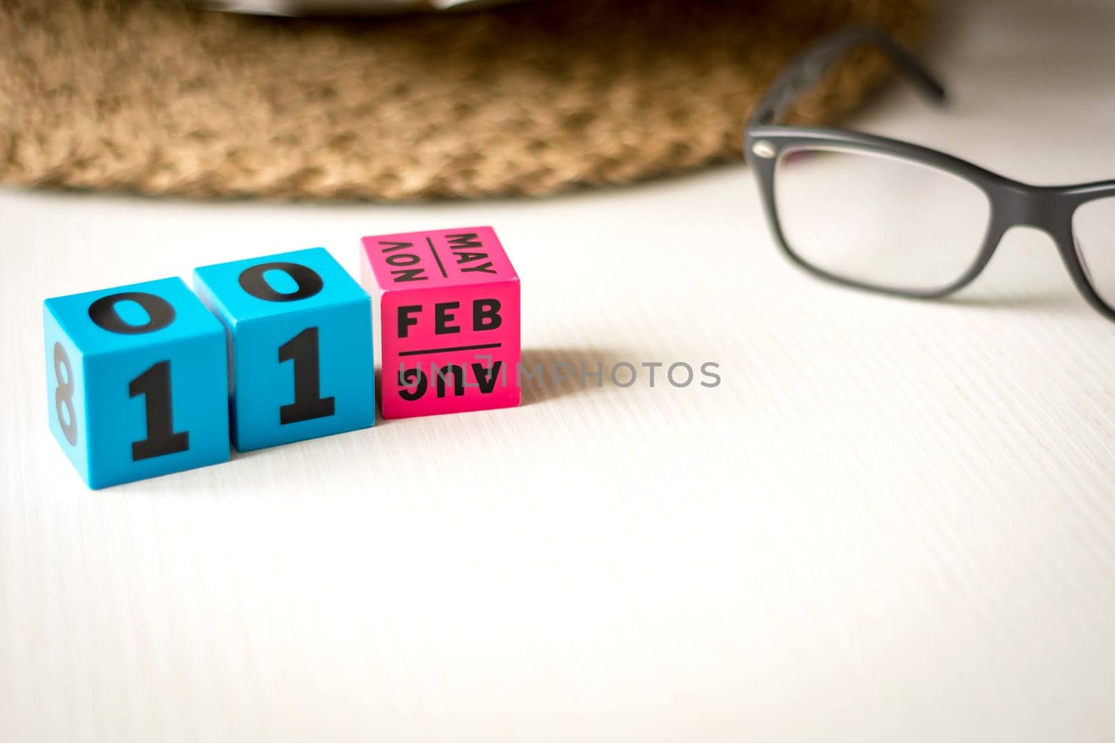 modern perpetual calendar composed of colored cubes and set at the date of February 11th