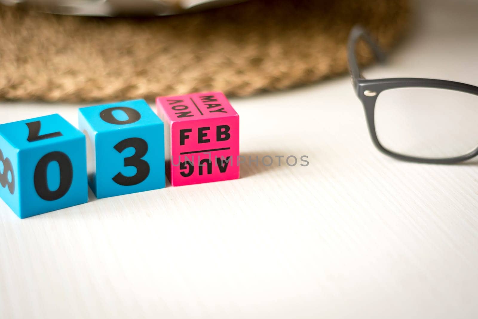 modern perpetual calendar composed of colored cubes and set at the date of February 3rd