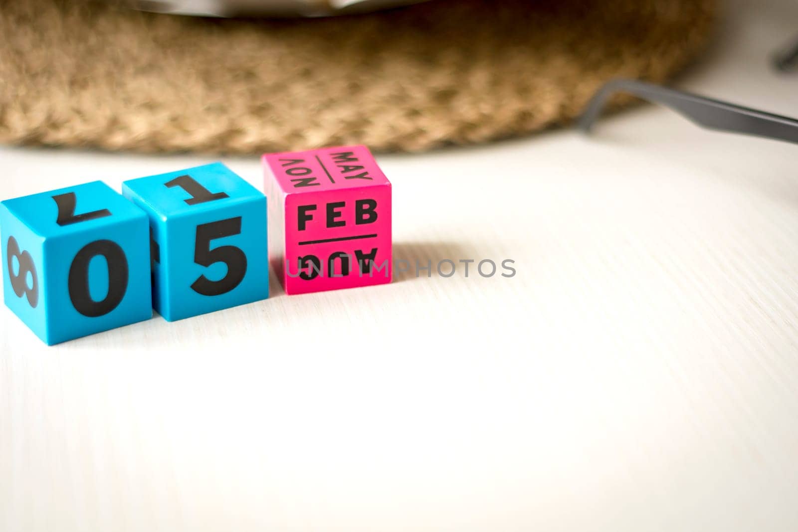modern perpetual calendar composed of colored cubes and set at the date of February 5th