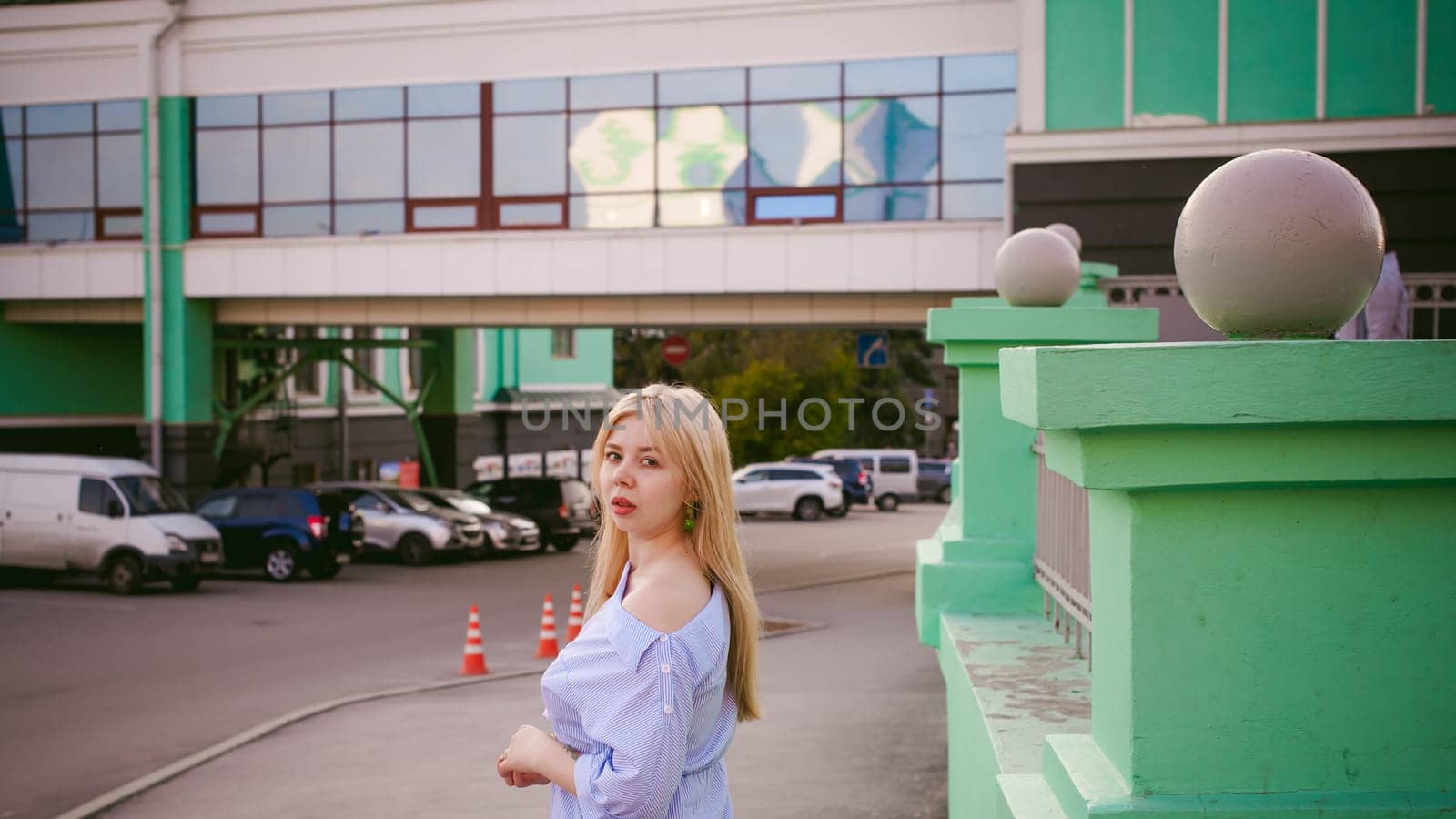 portrait of a cute young blond woman with a summer day