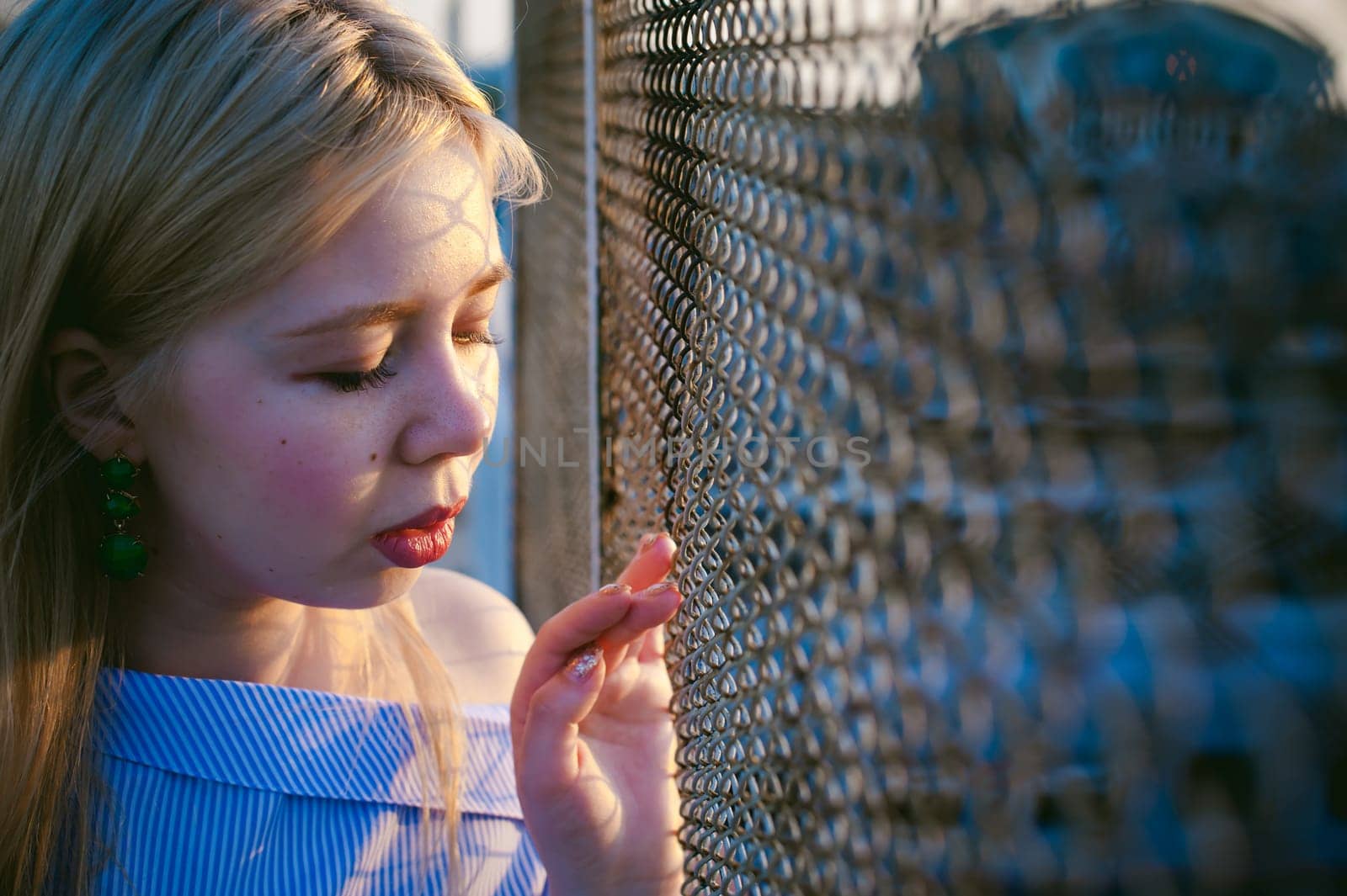 portrait of a cute young blond woman with a summer day