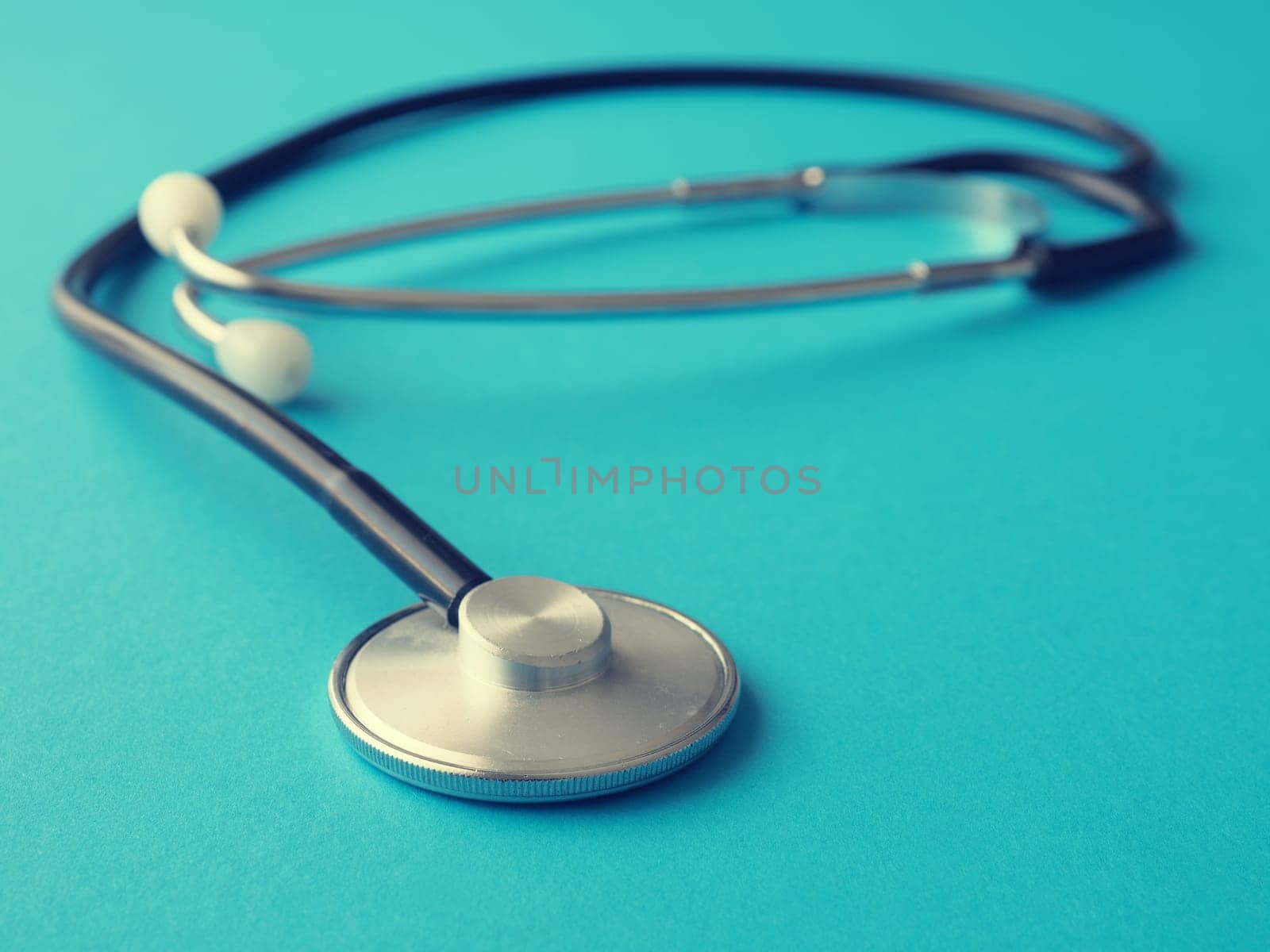 Stethoscope on a blue background, heath care or medical concept background