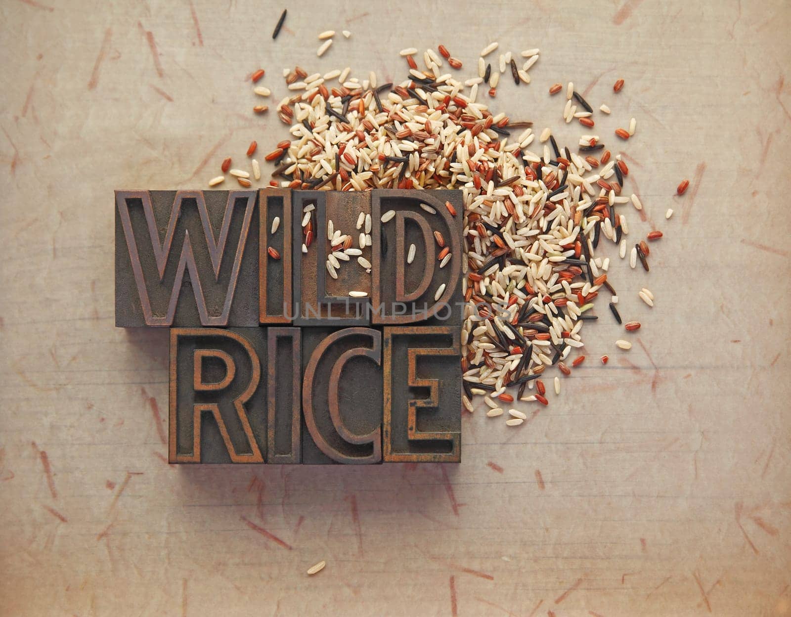 Wild rice with wood type words on textured background with room for text
