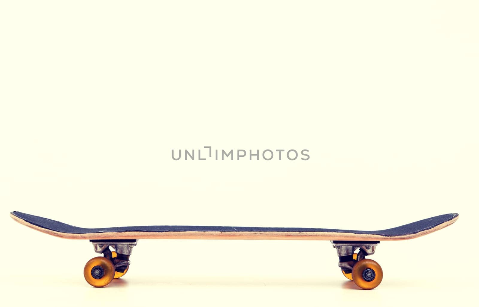 skateboard in front of bright background - horizontal