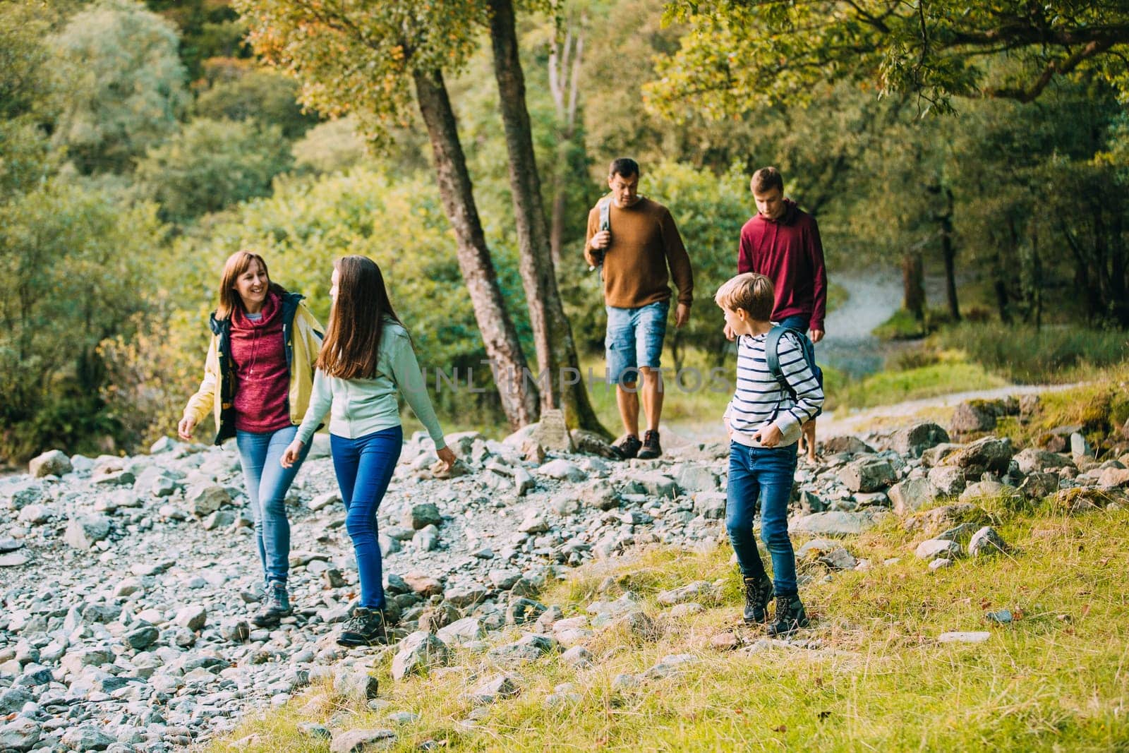 Family are hiking together through the Lake District.