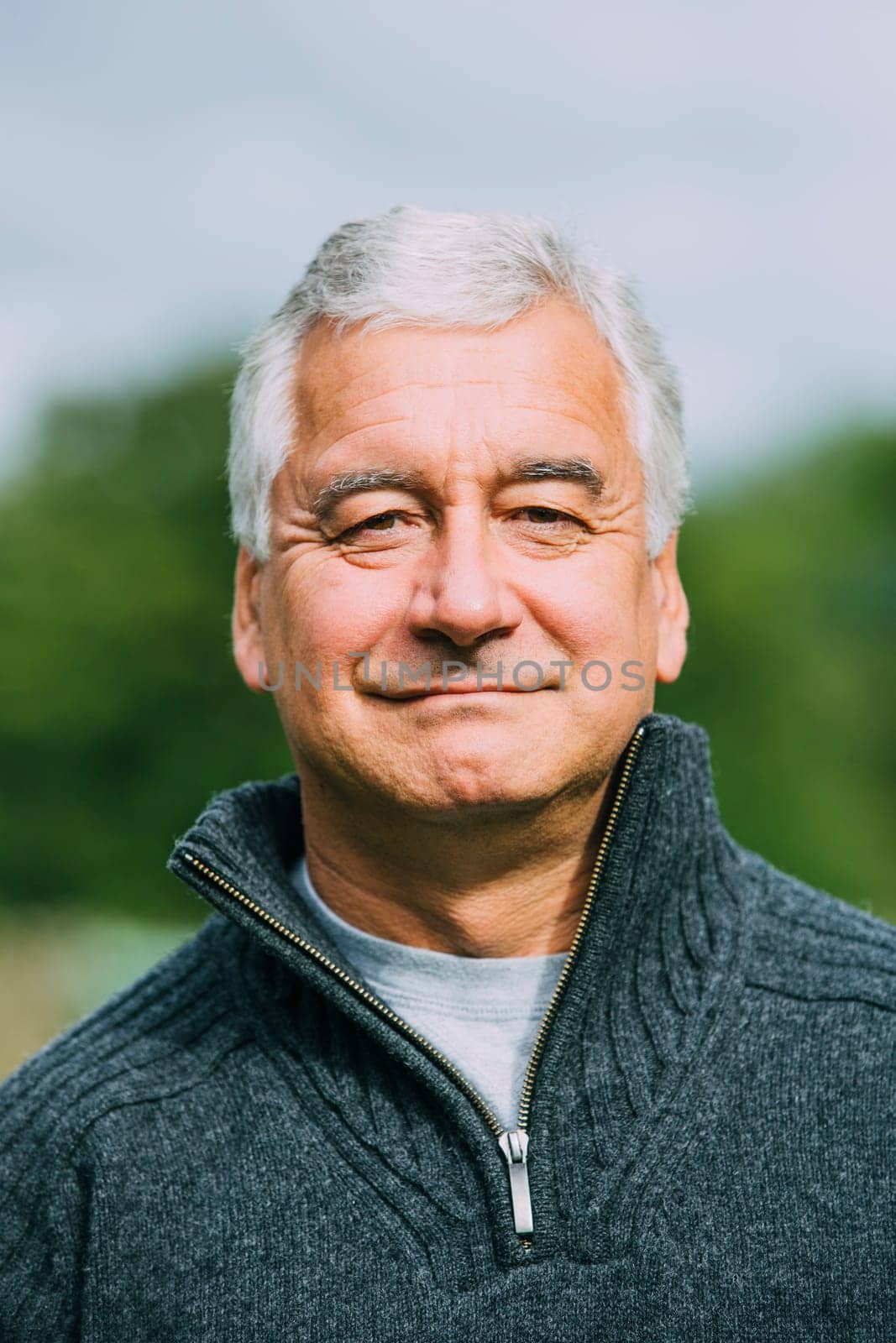 Portrait of a senior man while out hiking.