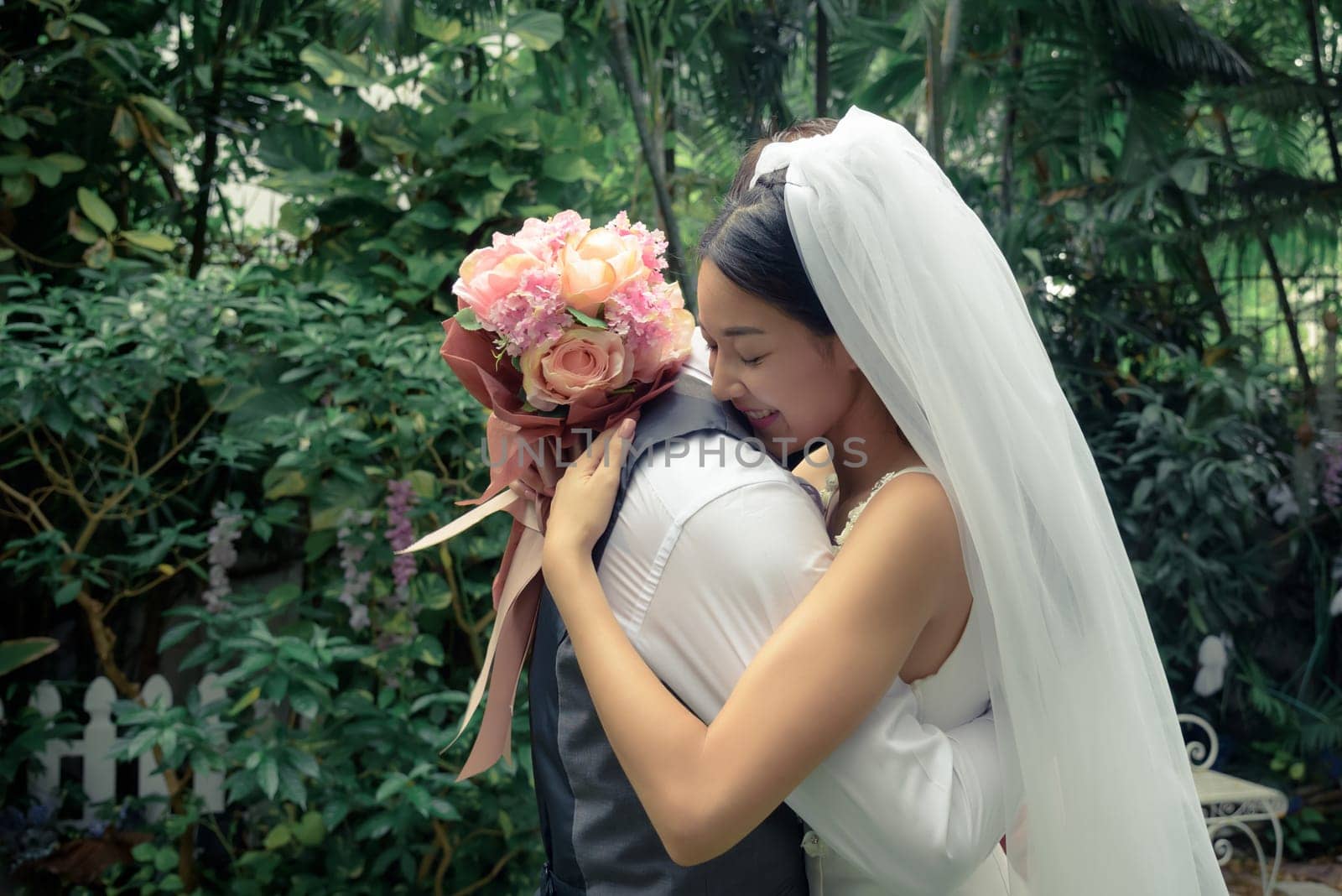 Wedding couple, groom and bride, beautiful woman and man, hug each other and hold bouquet flower, love and valentine concept