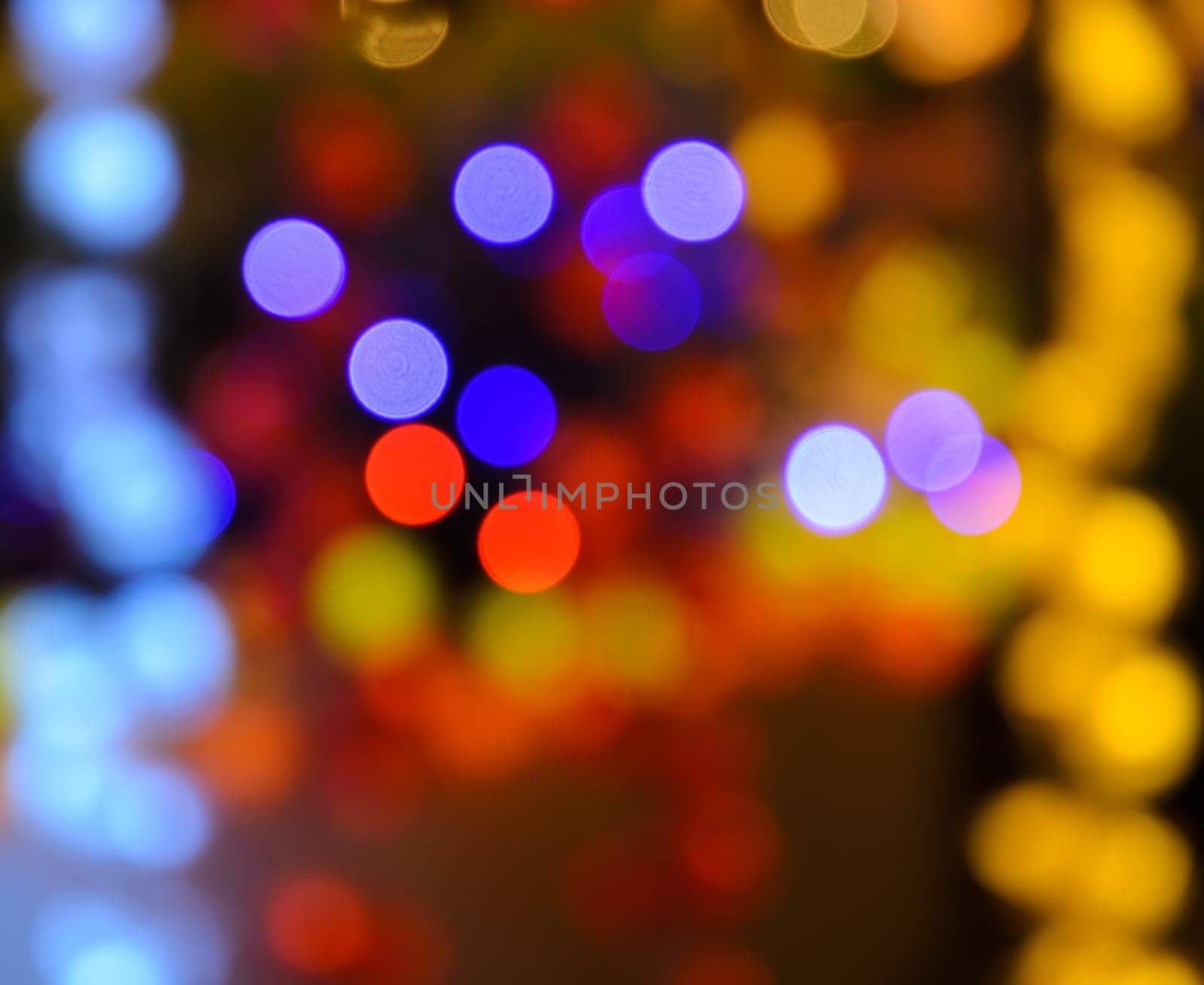 Abstract colorful bokeh background of de-focused Christmas lights