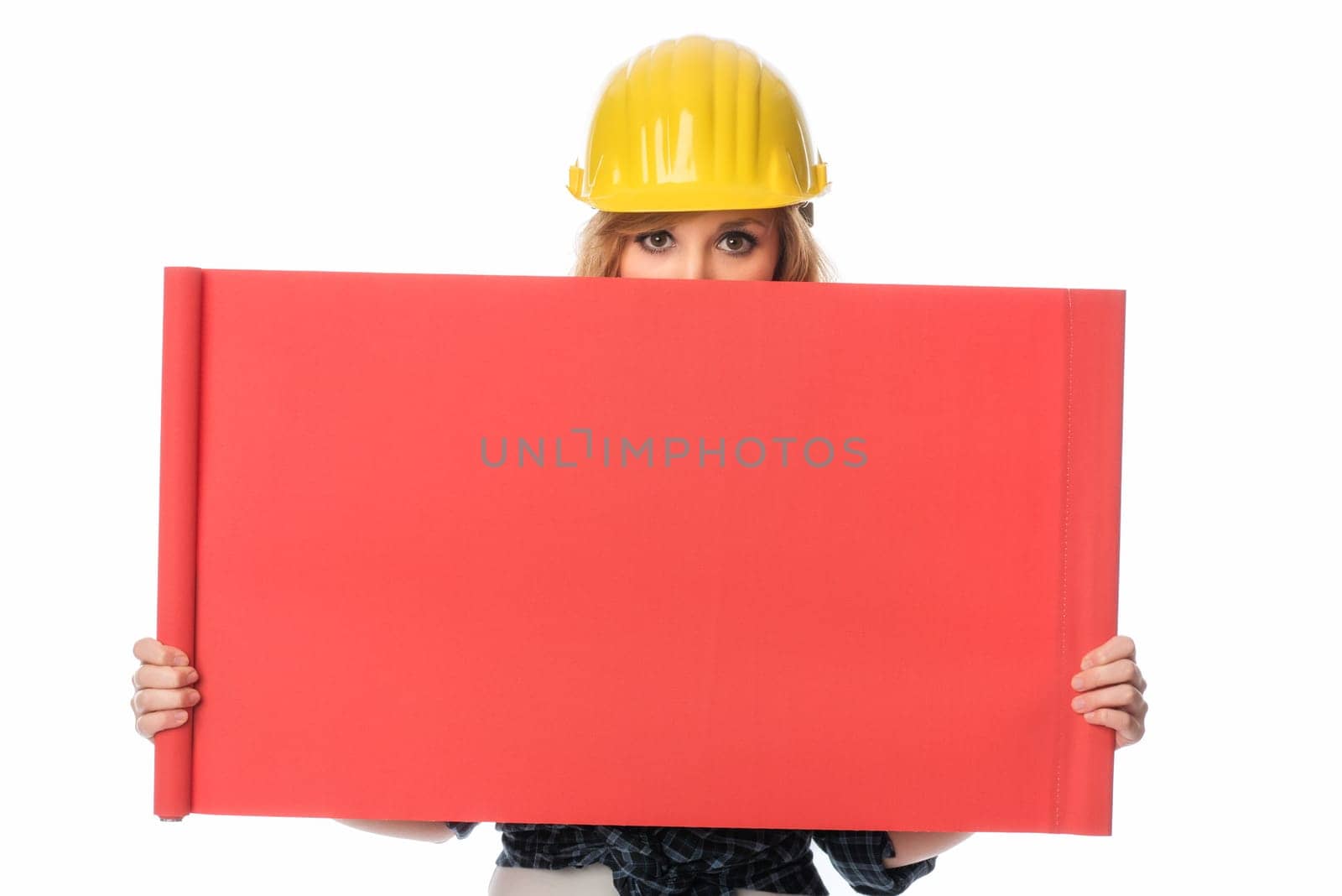 Construction worker holds up advertising poster
