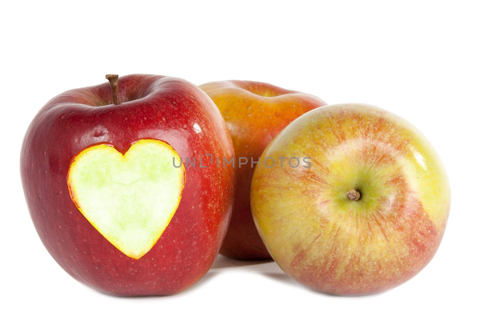Red apples with heart isolated on white