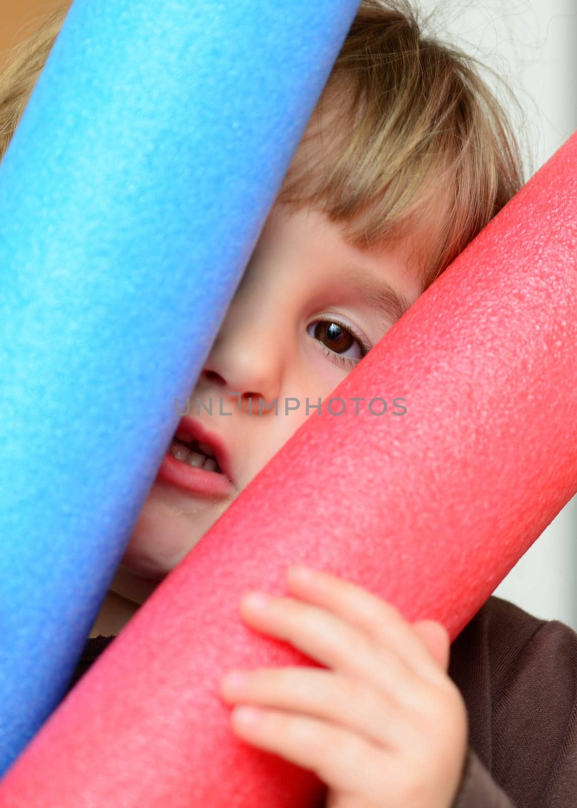 Girl with swimming noodle