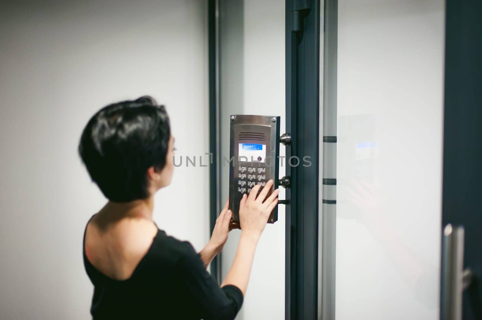 woman is calling on the intercom