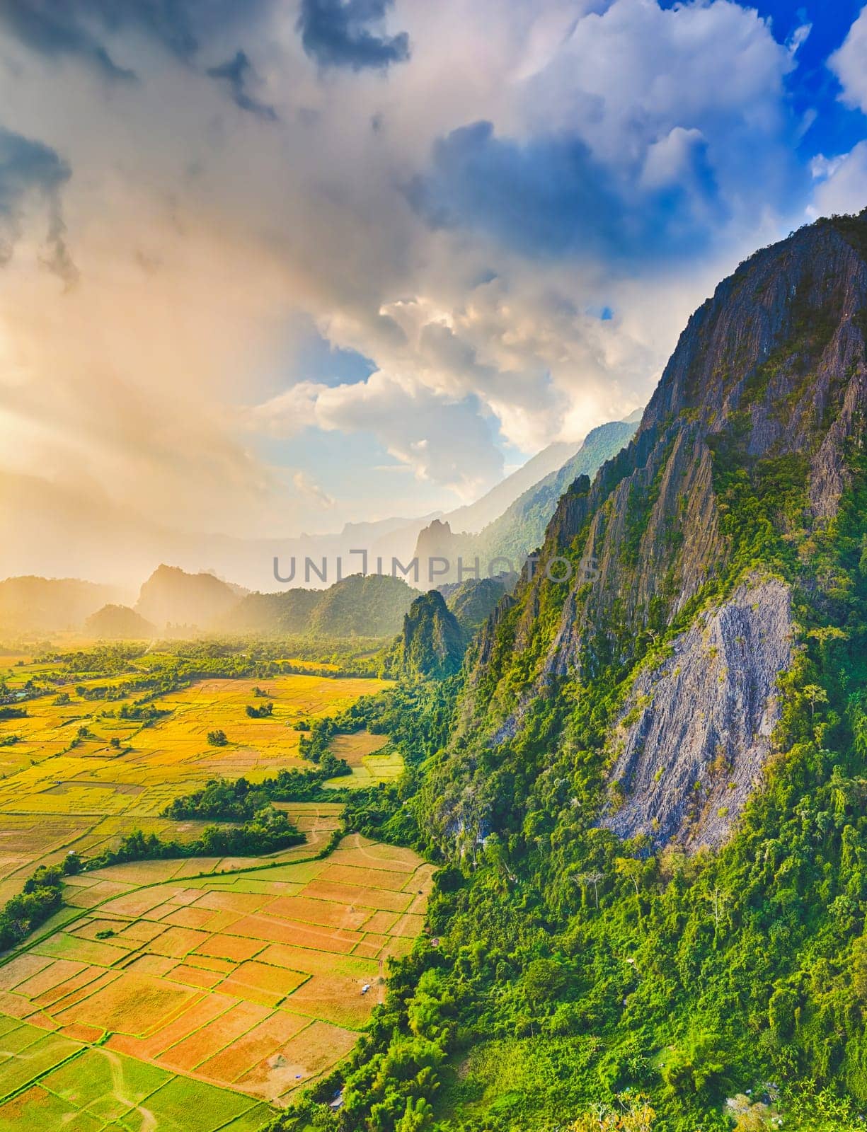 Aerial view of the fields and mountain. Beautiful landscape. Vang Vieng. Laos.