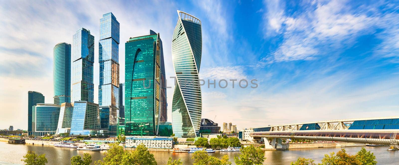 Moscow City skyline . Moscow International Business Centre at day time with Moskva river in foreground . Panorama